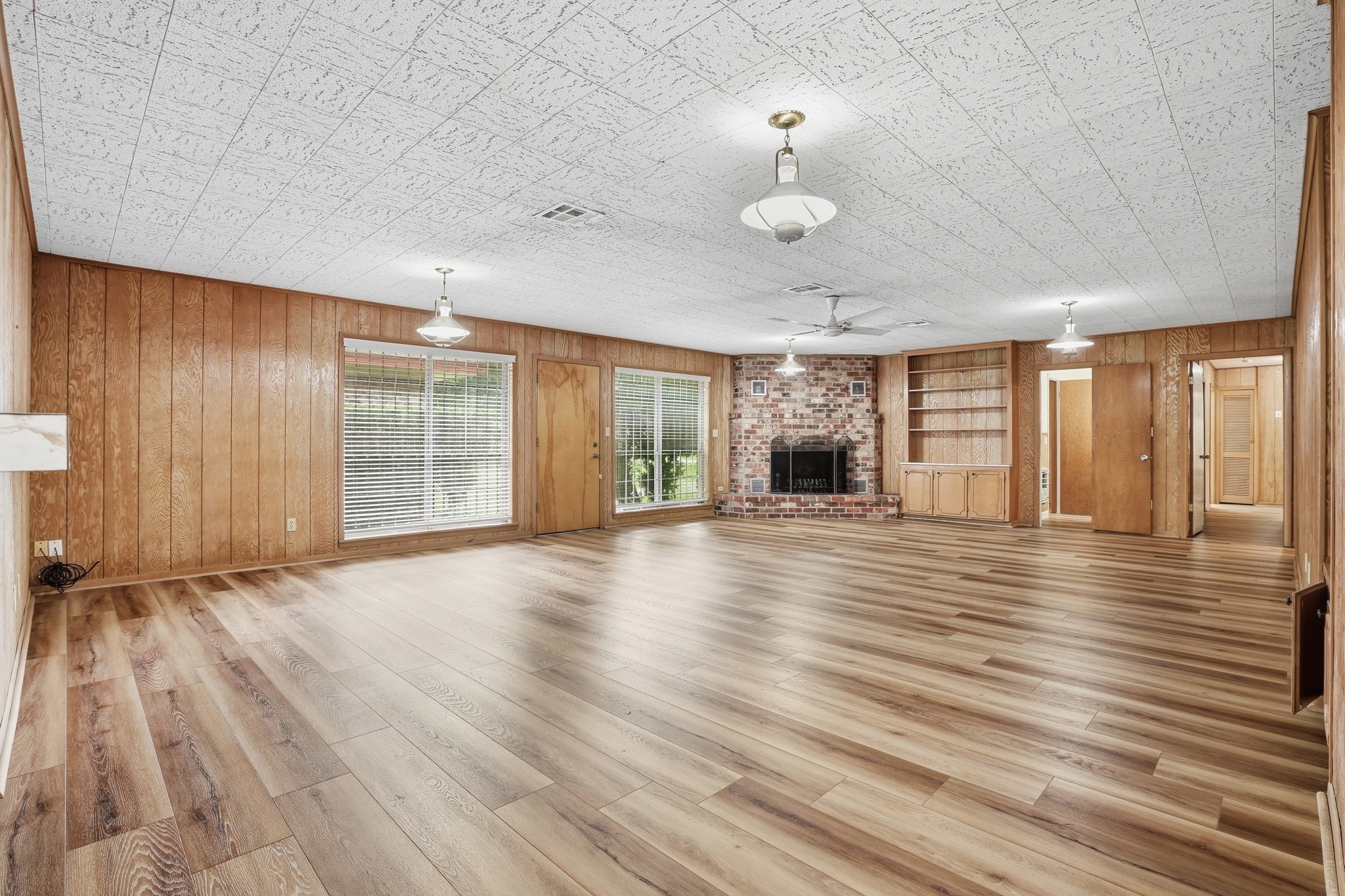 10240 Post Oak Drive Conroe, TX 77385 - Photo 20 of 46 a view of an empty room with wooden floor and a window