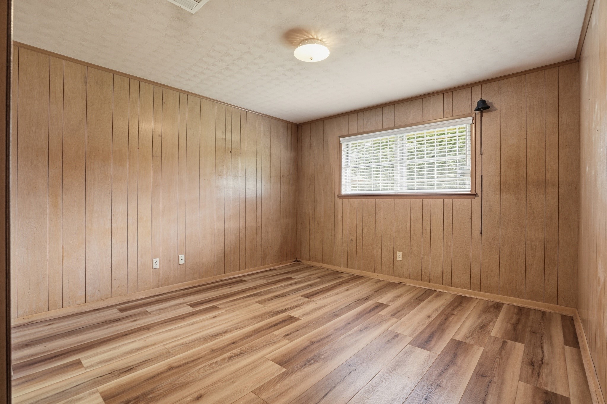 10240 Post Oak Drive Conroe, TX 77385 - Photo 24 of 46 a view of an empty room with wooden floor and a window