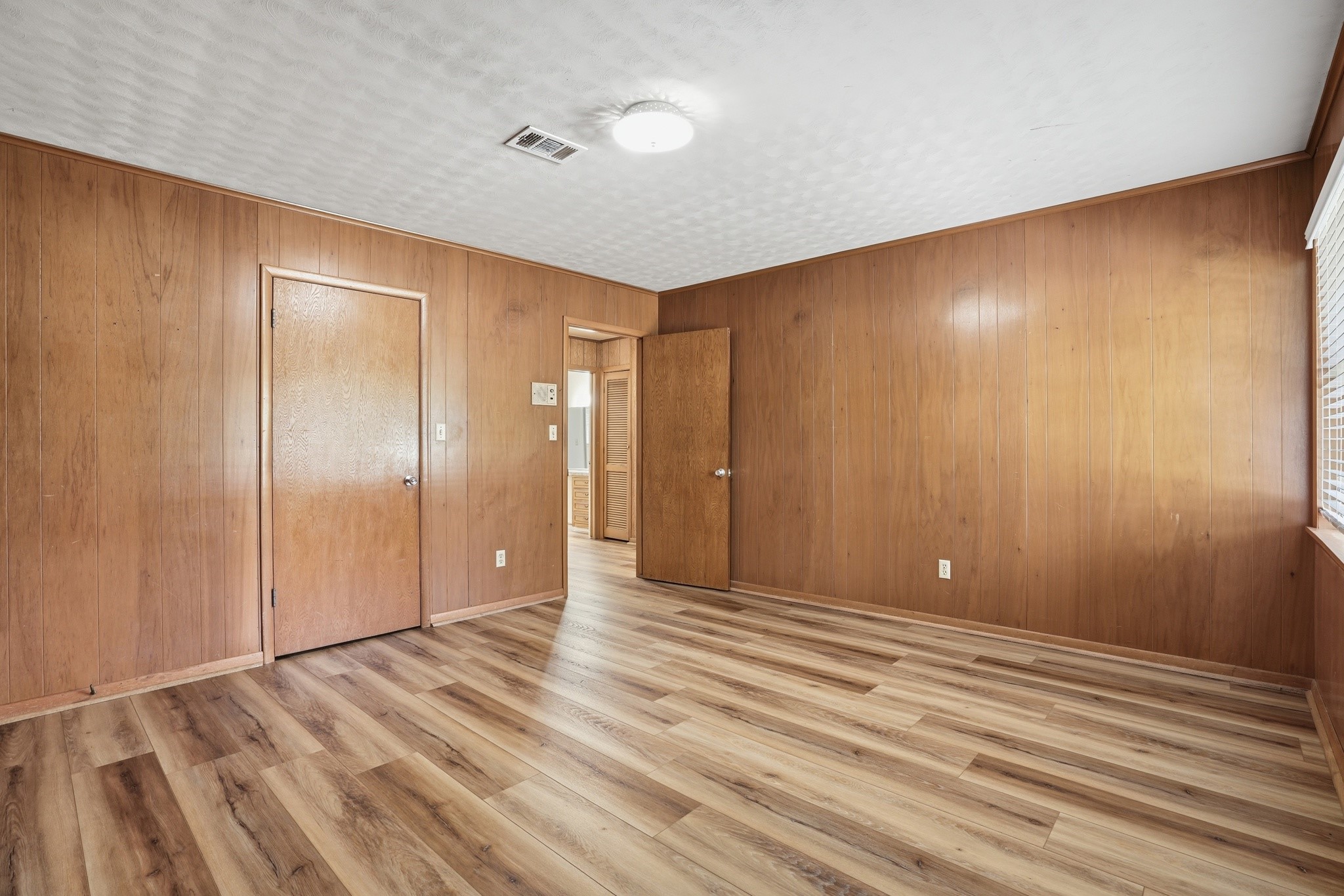 10240 Post Oak Drive Conroe, TX 77385 - Photo 28 of 46 a view of room with wooden floor