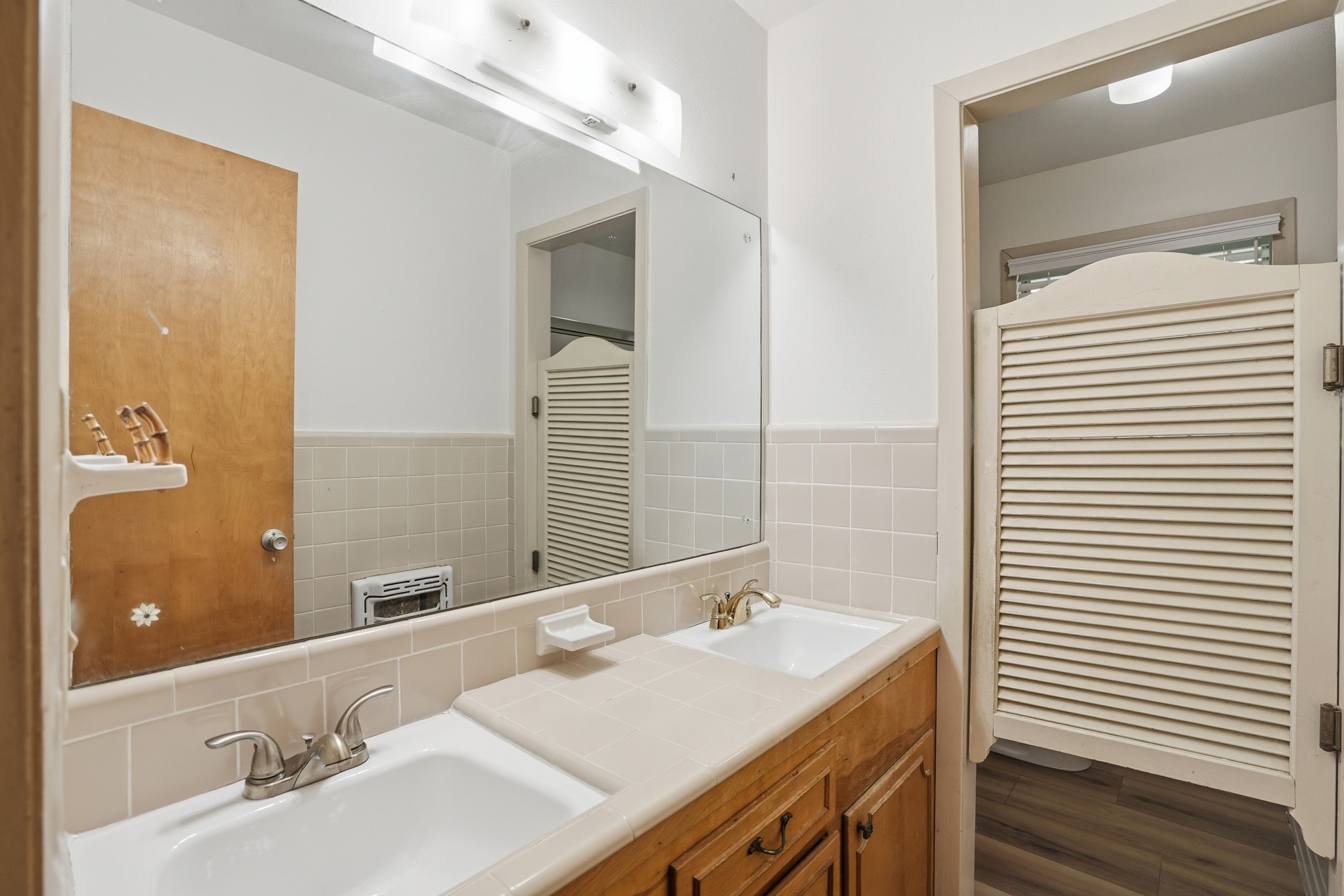 10240 Post Oak Drive Conroe, TX 77385 - Photo 31 of 46 a bathroom with a granite countertop sink and a mirror