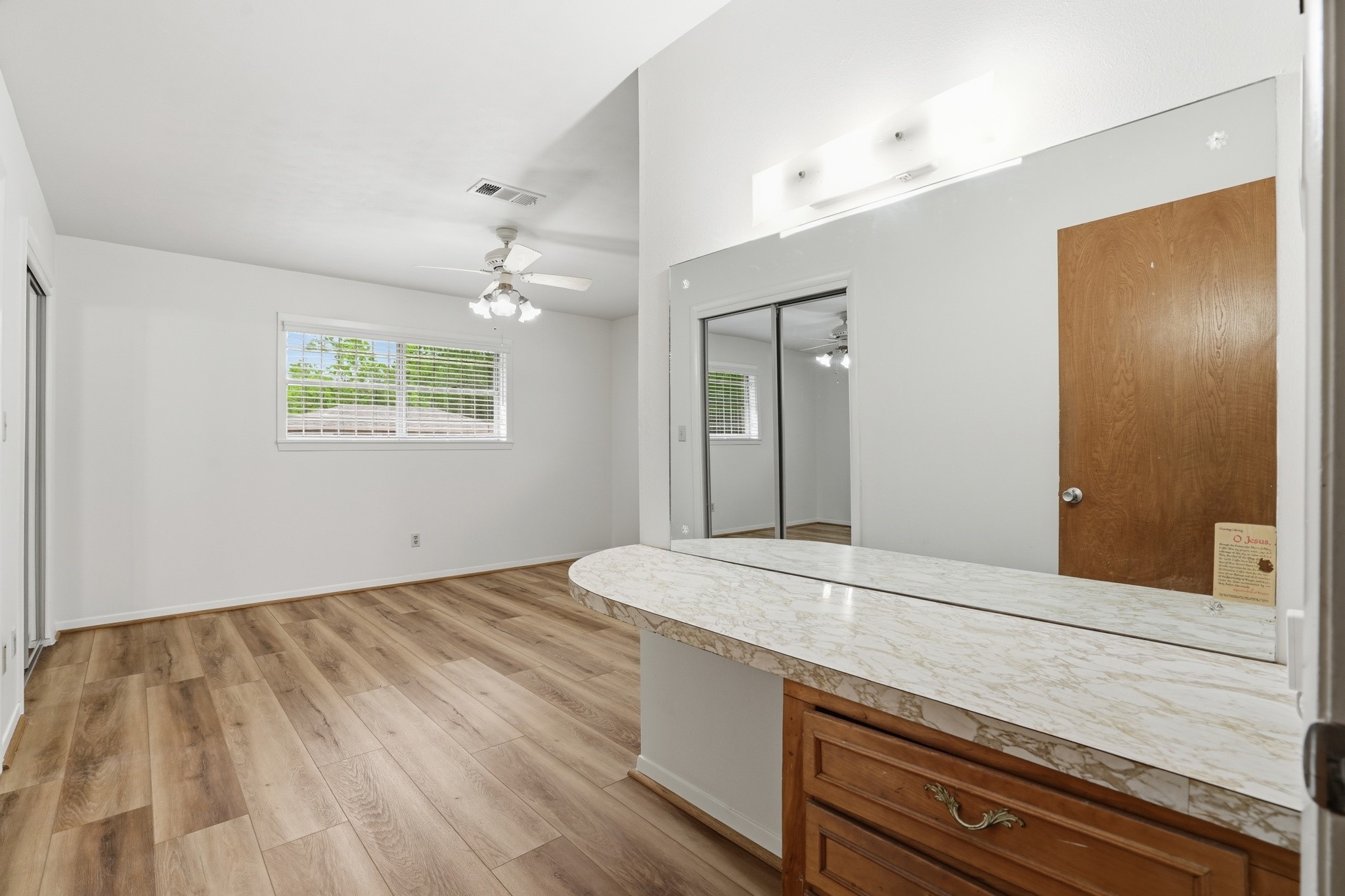 10240 Post Oak Drive Conroe, TX 77385 - Photo 33 of 46 a bathroom with a sink and a mirror