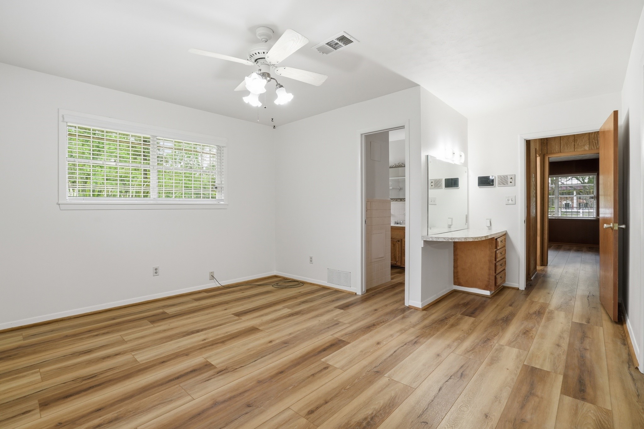 10240 Post Oak Drive Conroe, TX 77385 - Photo 34 of 46 wooden floor in an empty room with a window
