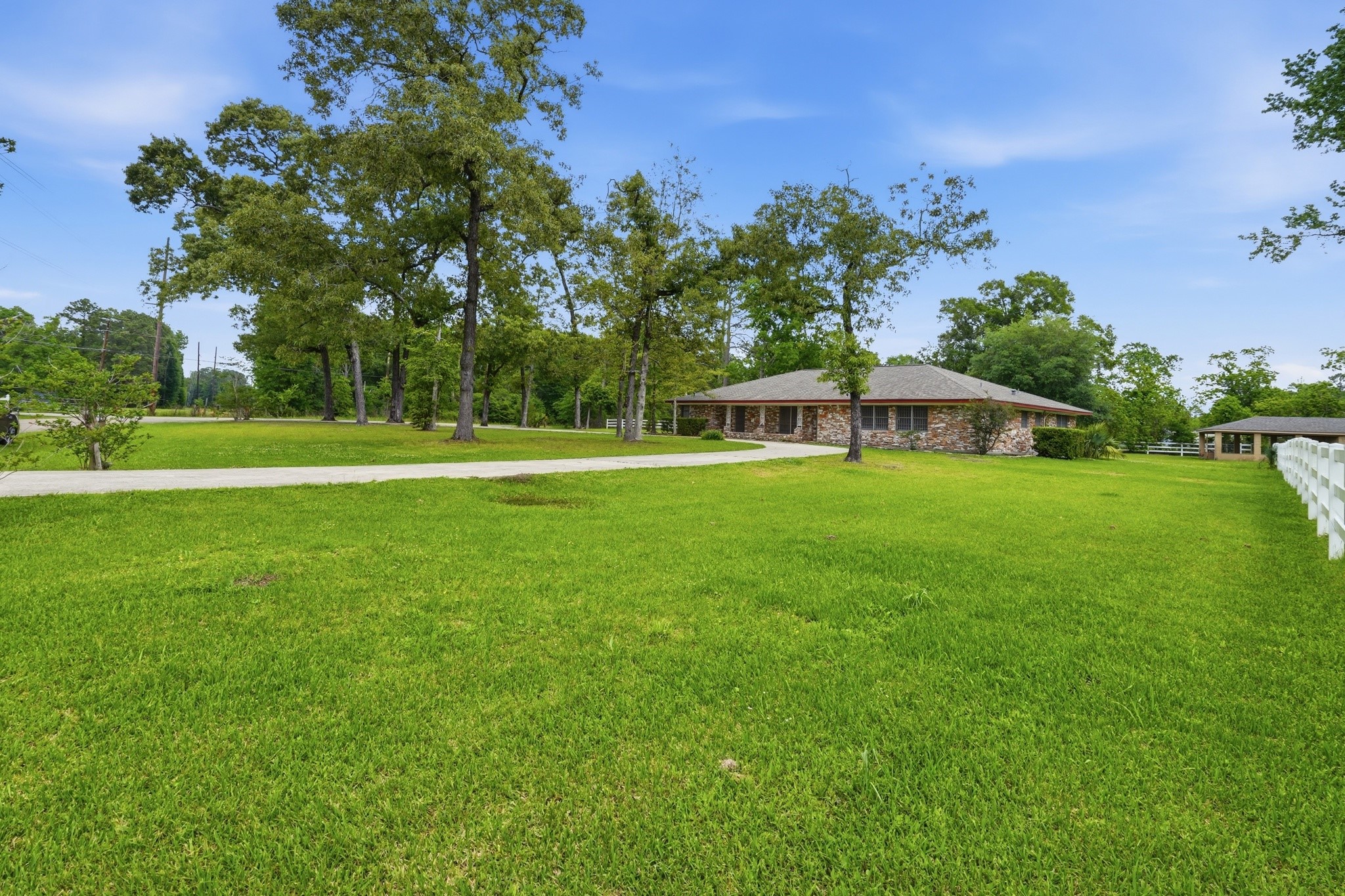 10240 Post Oak Drive Conroe, TX 77385 - Photo 5 of 46 a view of a house with a big yard