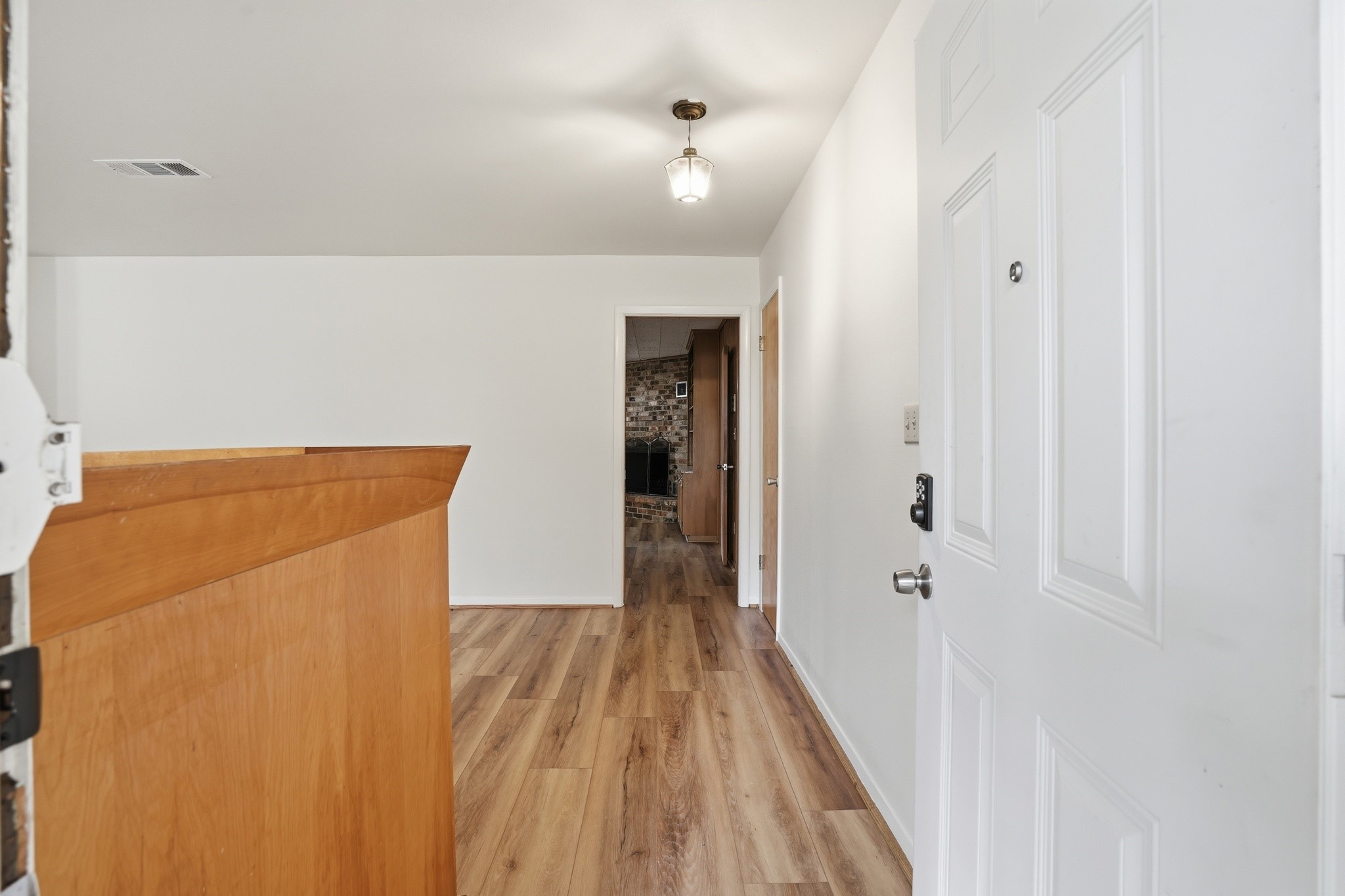 10240 Post Oak Drive Conroe, TX 77385 - Photo 7 of 46 a view of a hallway with wooden floor