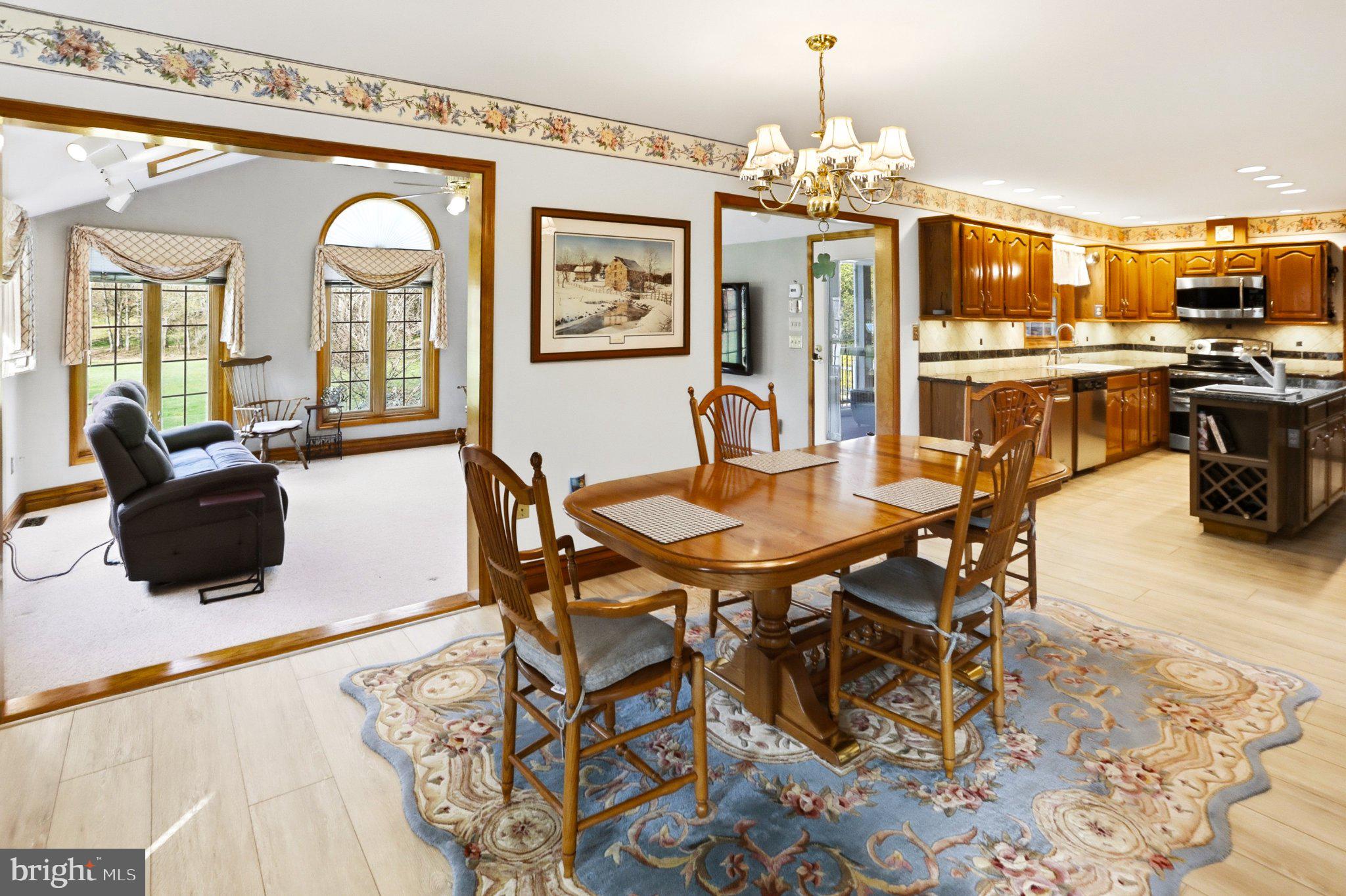 42 Eleanor Drive Spring City, PA 19475 - Photo 20 of 59 a view of a dining room with furniture and chandelier