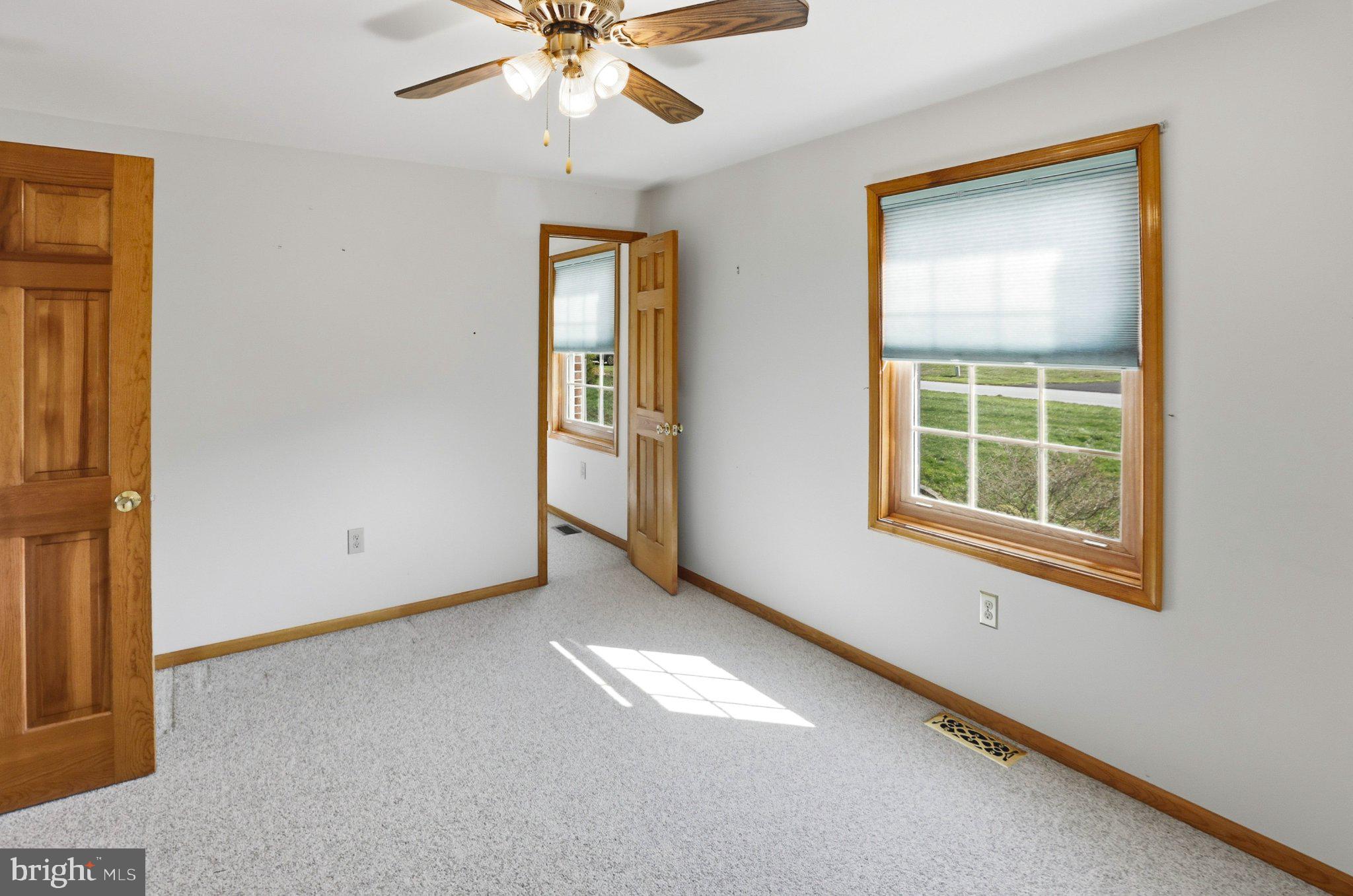 42 Eleanor Drive Spring City, PA 19475 - Photo 43 of 59 an empty room with windows and fan