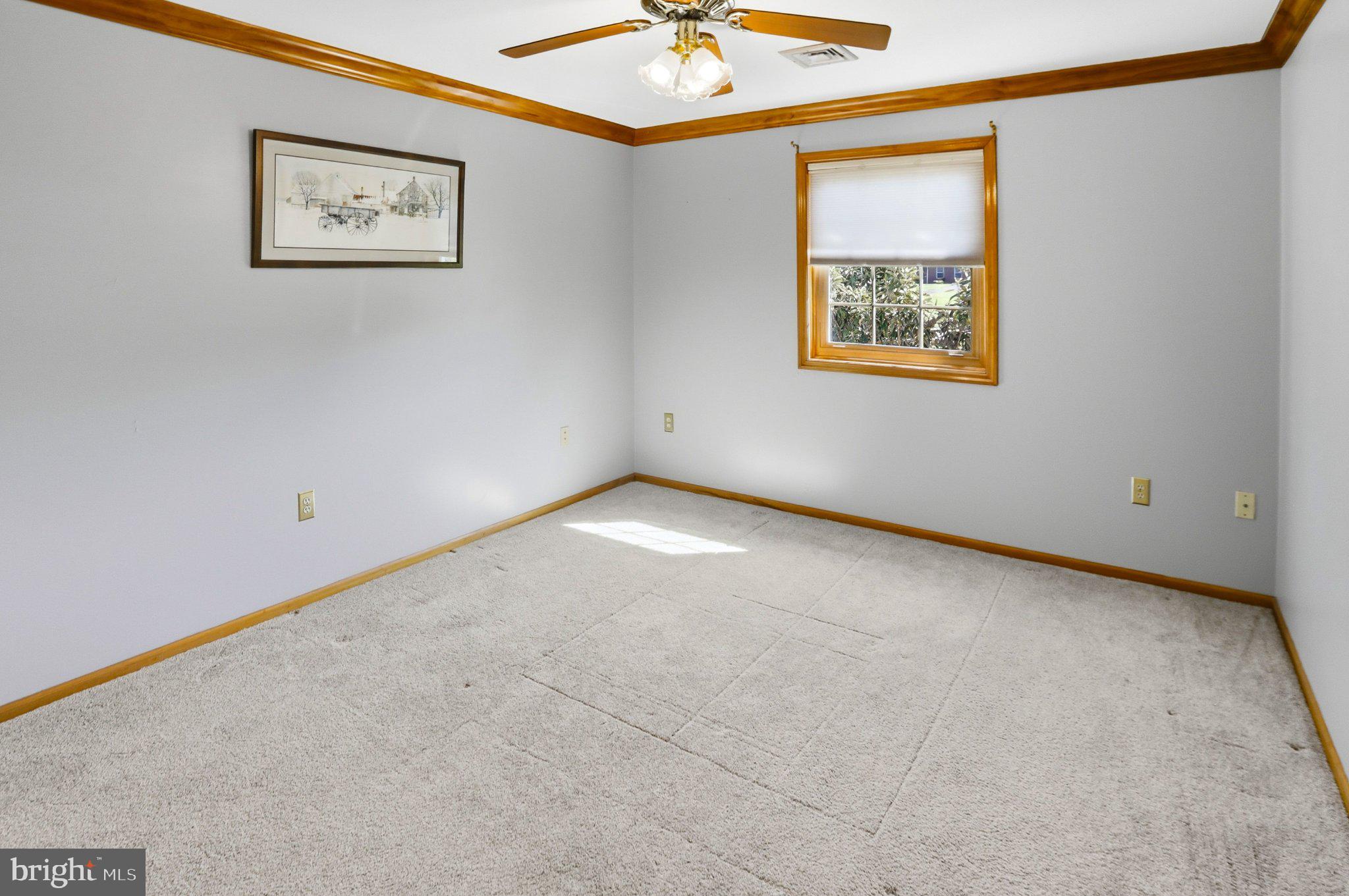 42 Eleanor Drive Spring City, PA 19475 - Photo 45 of 59 an empty room with a window and a ceiling fan