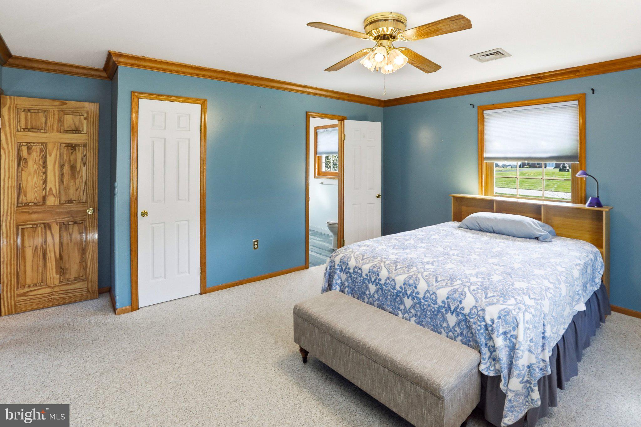 42 Eleanor Drive Spring City, PA 19475 - Photo 49 of 59 a bedroom with a bed and a chandelier