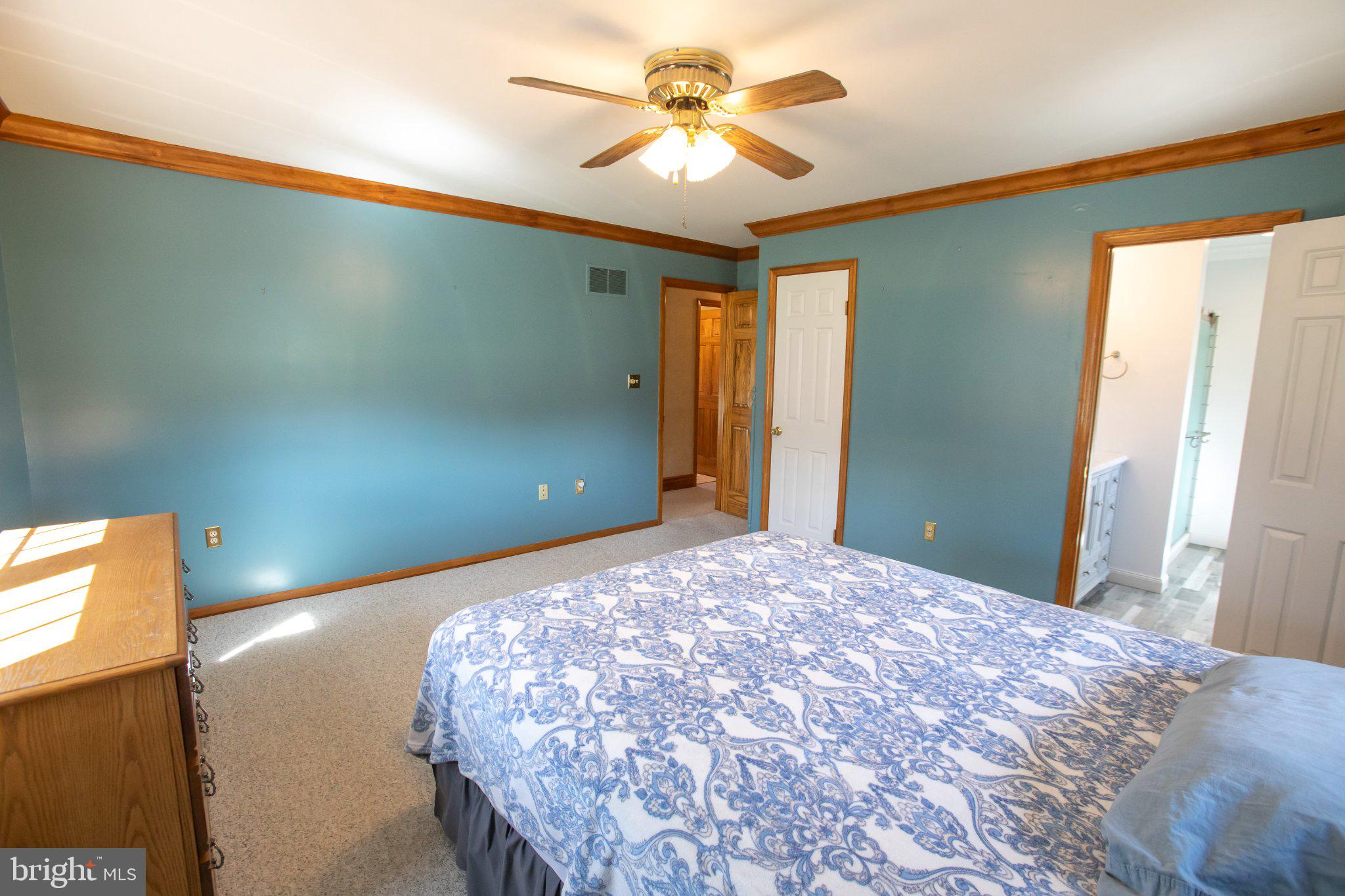 42 Eleanor Drive Spring City, PA 19475 - Photo 50 of 59 a bedroom with a bed and a chandelier fan