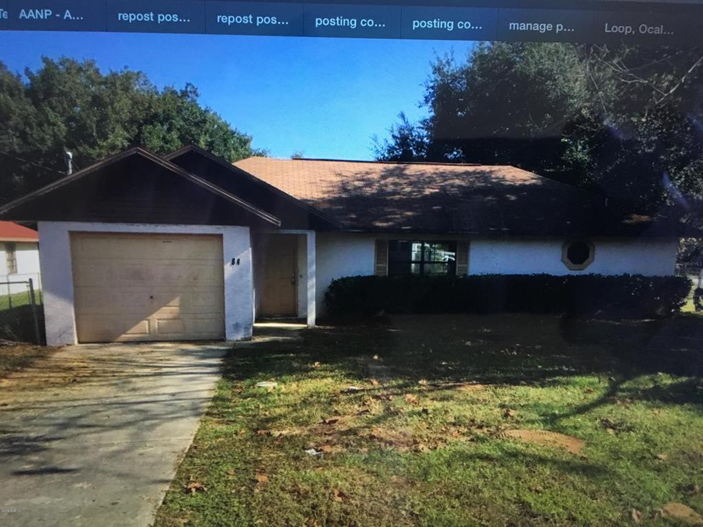64 Water Track Loop Ocala, FL 34472 - Photo 1 of 1 a house view with a garden space