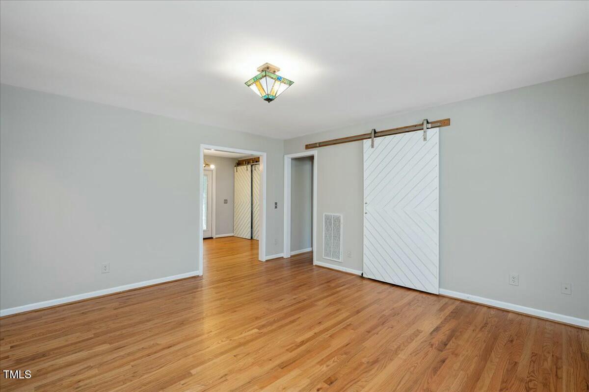 552 Moseley Lane Raleigh, NC 27601 - Photo 5 of 25 a view of an empty room with wooden floor