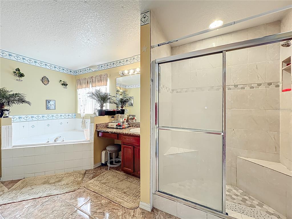 7939 Riffle Lane Orlando, FL 32818 - Photo 28 of 52 a room with a refrigerator and a table