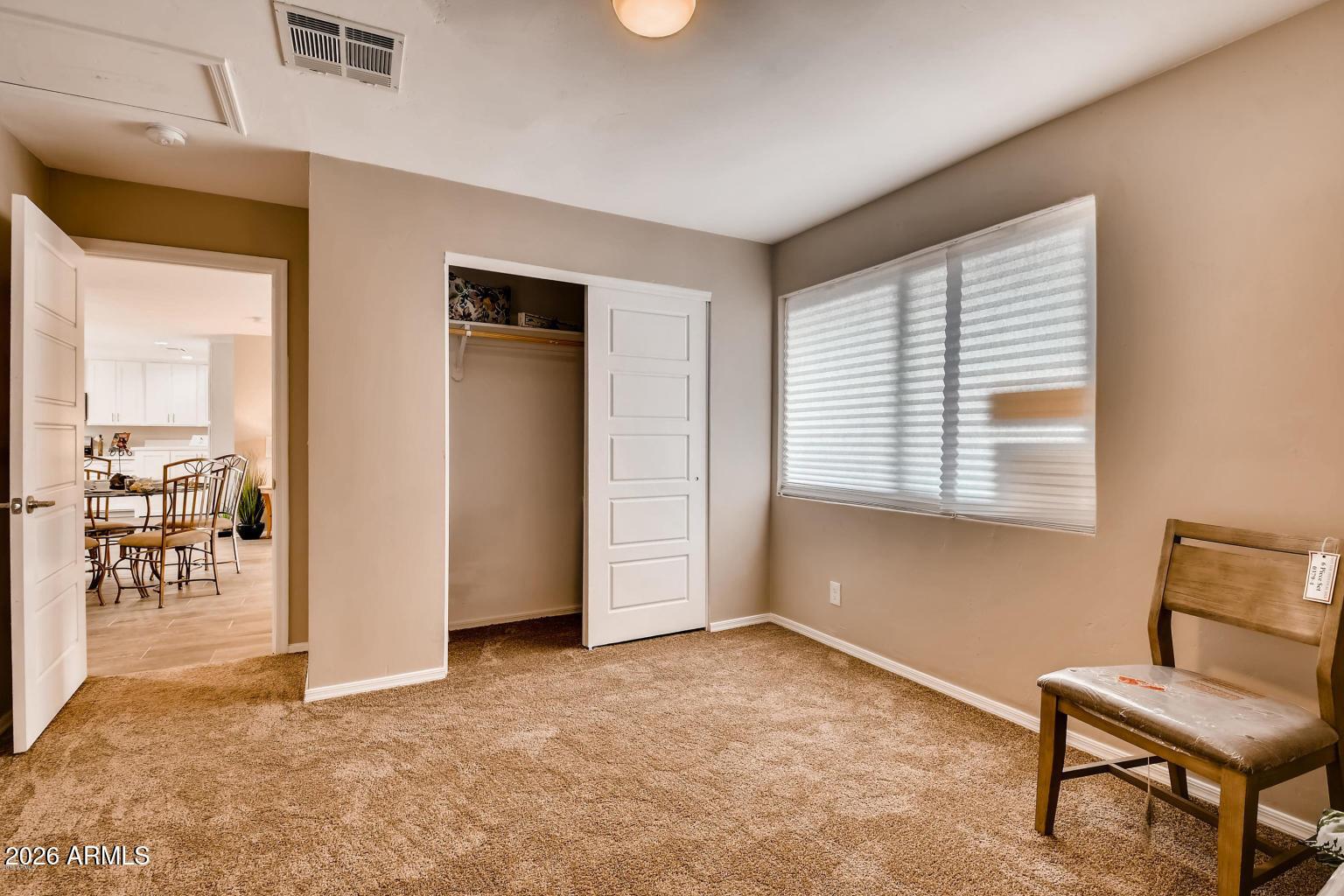 1806 East Don Carlos Tempe, AZ 85281 - Photo 11 of 14 a view of room with window and a wooden floor