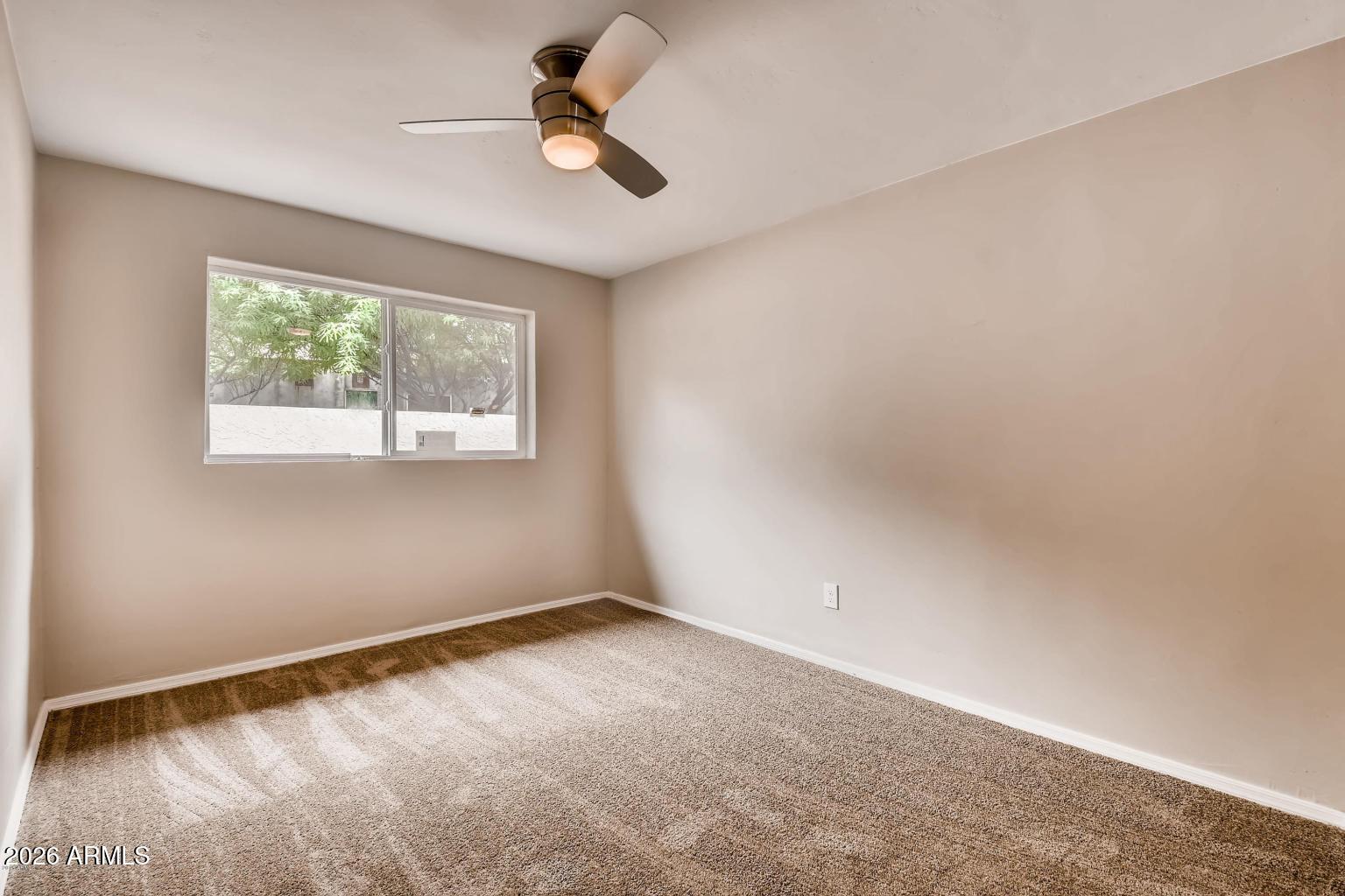 1806 East Don Carlos Tempe, AZ 85281 - Photo 13 of 14 an empty room with a window