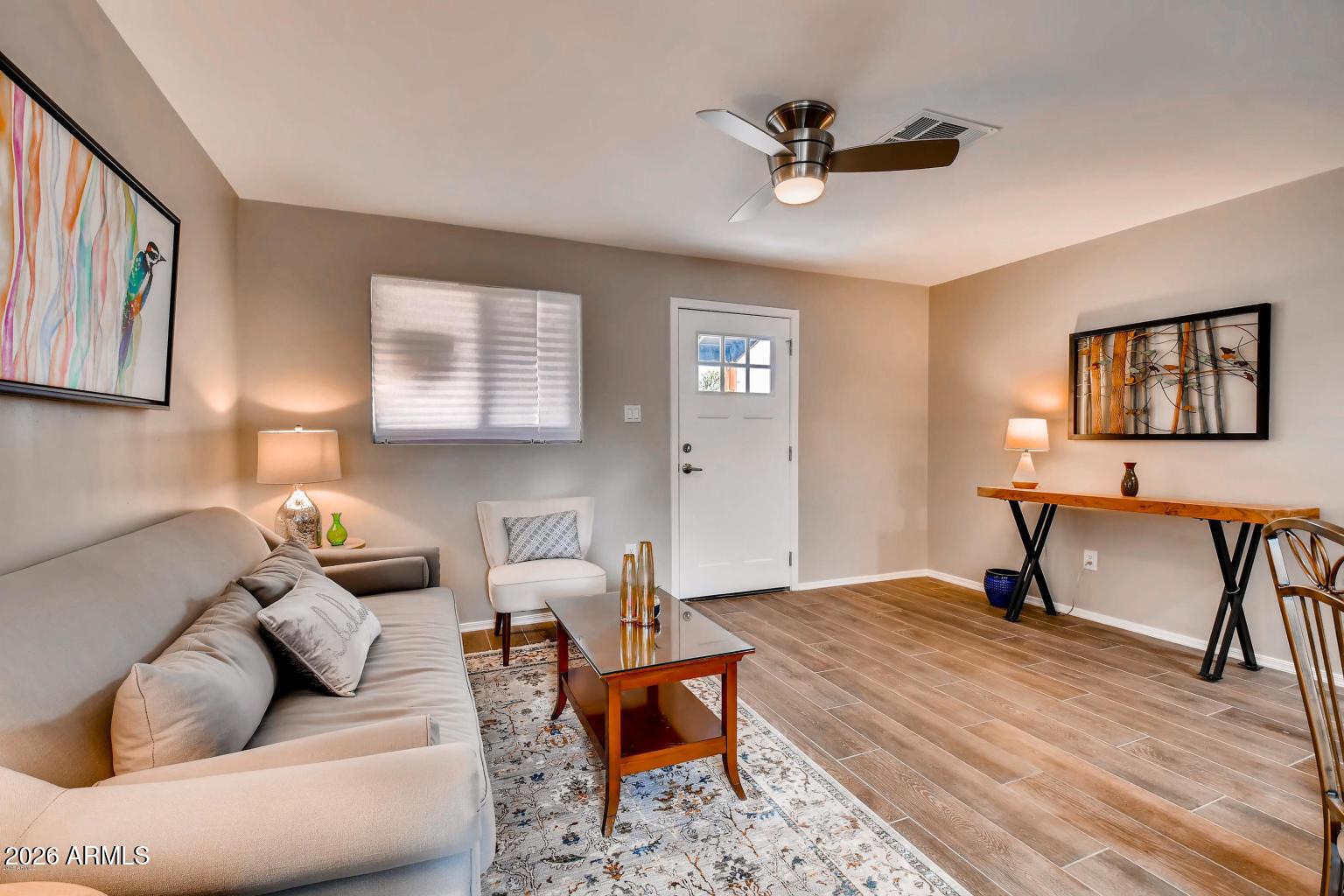 1806 East Don Carlos Tempe, AZ 85281 - Photo 2 of 14 a living room with furniture ceiling fan and a window