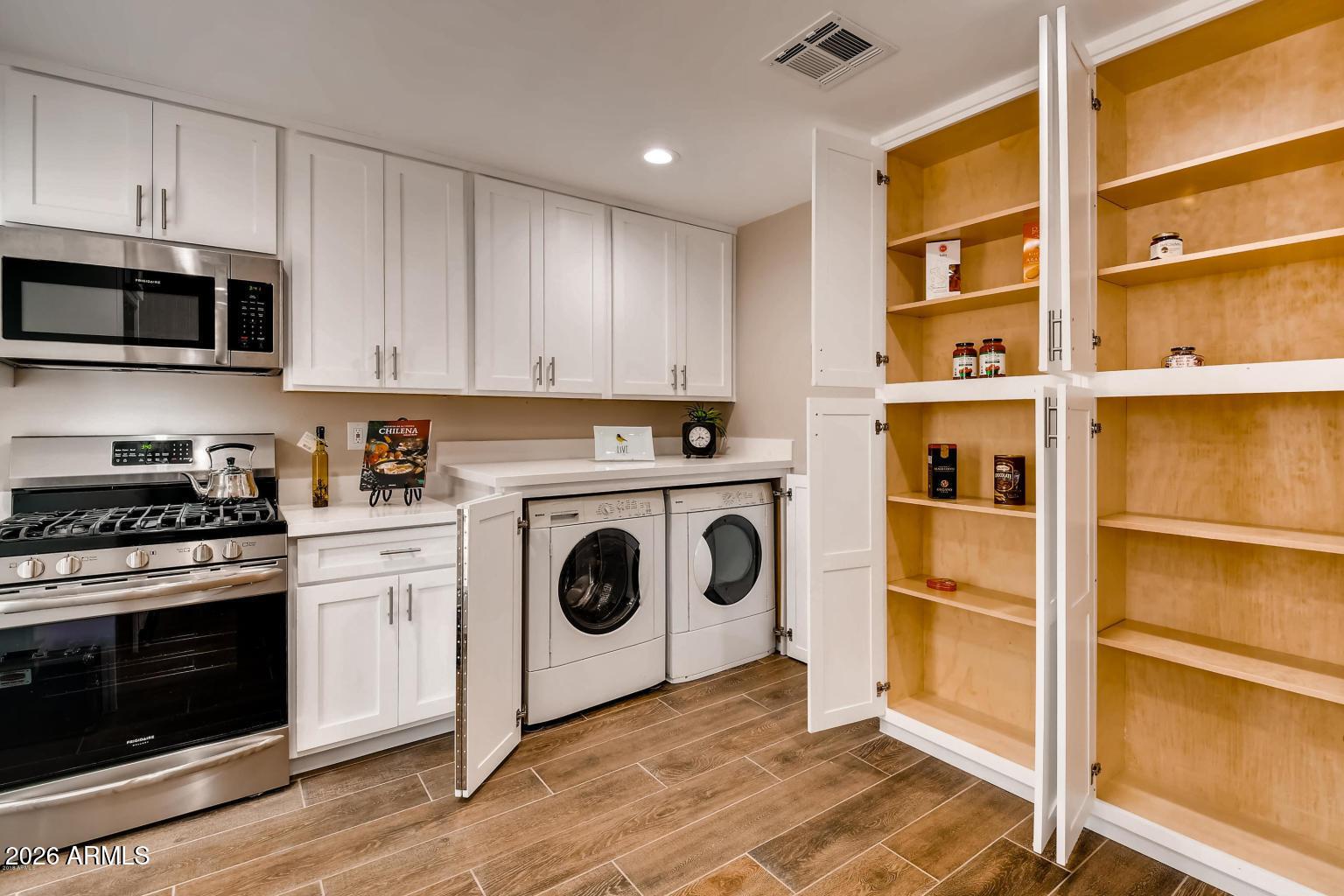 1806 East Don Carlos Tempe, AZ 85281 - Photo 6 of 14 a kitchen with stainless steel appliances granite countertop a stove and a refrigerator
