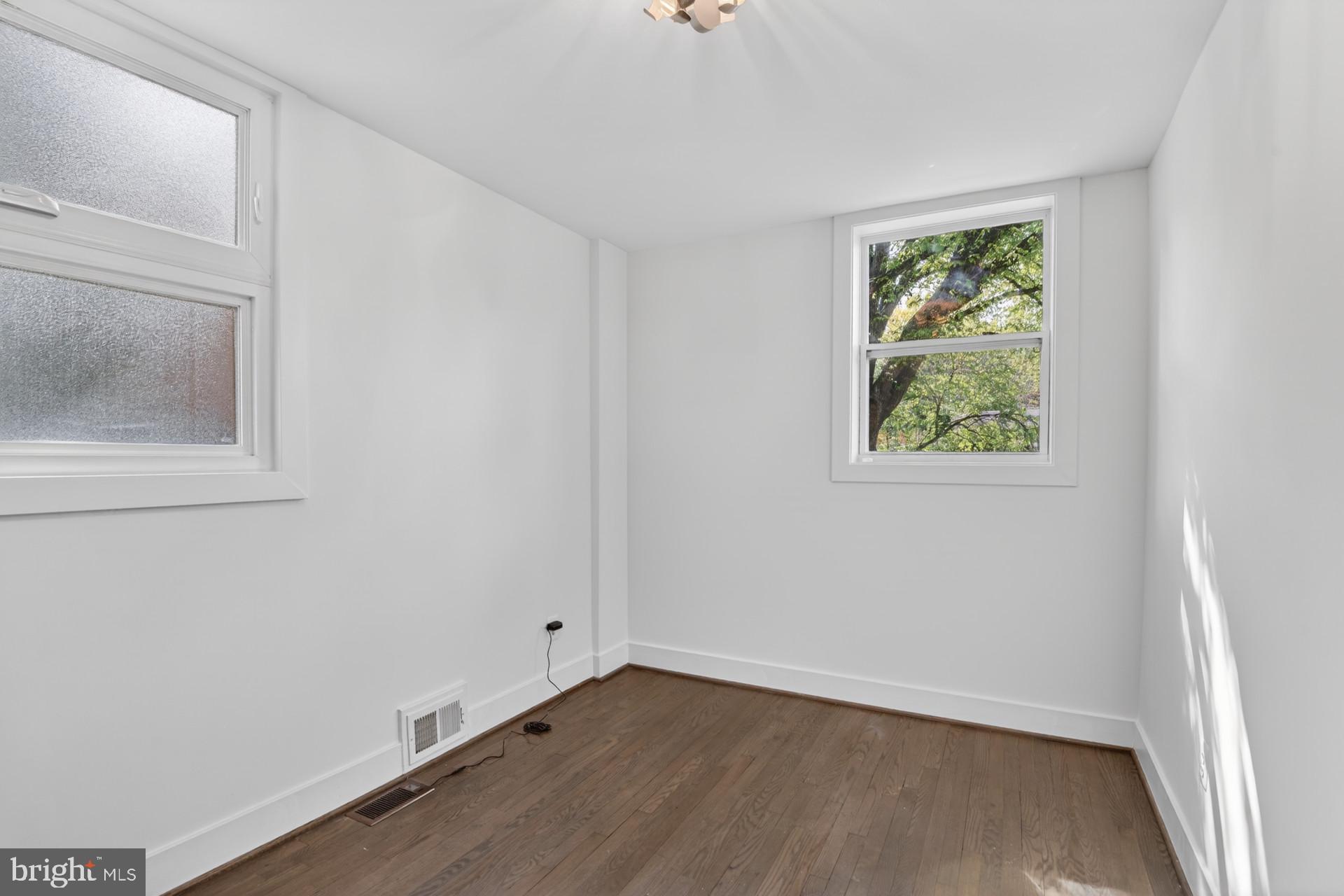 4416 Reno Road Northwest Washington, DC 20008 - Photo 19 of 39 an empty room with a window