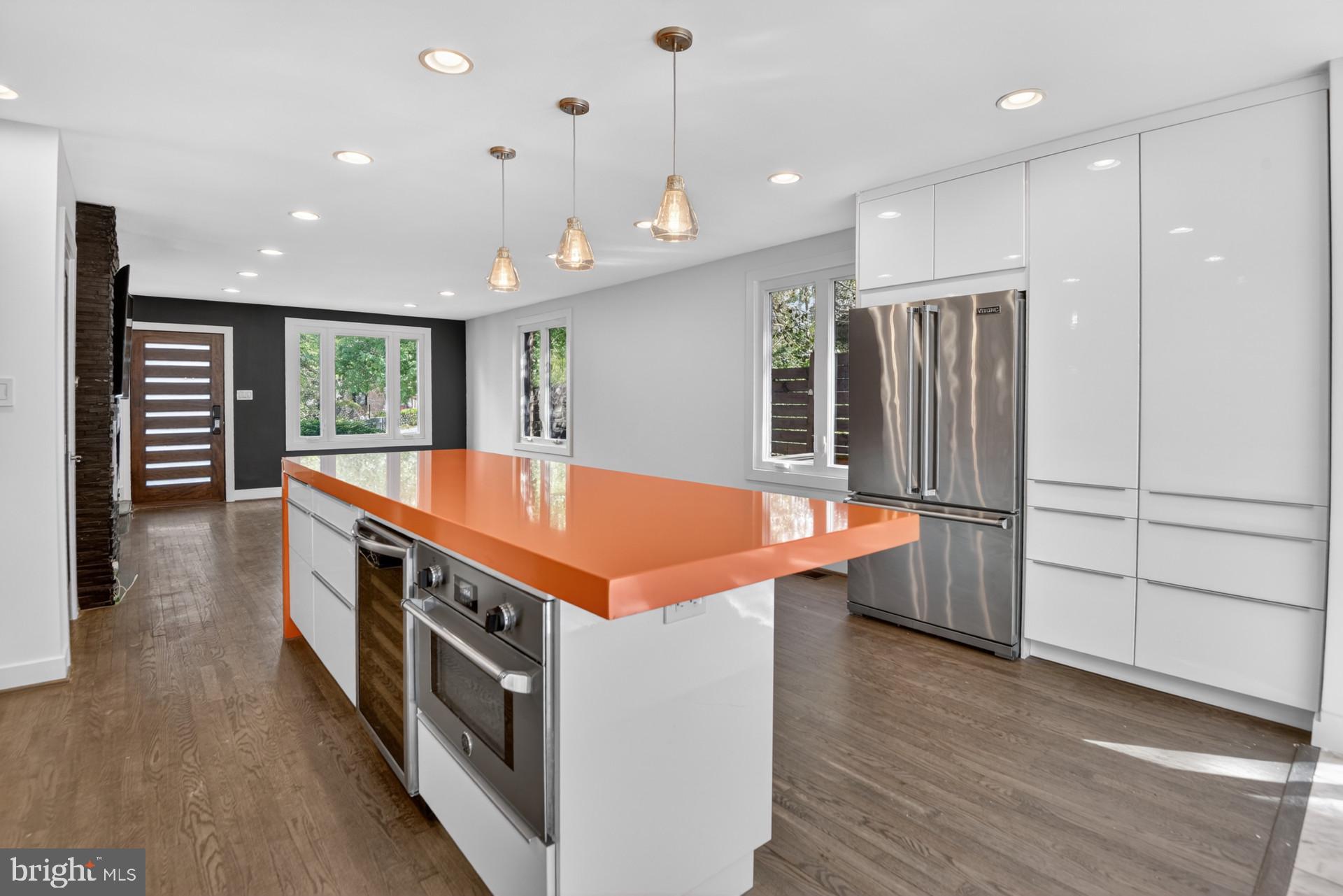 4416 Reno Road Northwest Washington, DC 20008 - Photo 2 of 39 a kitchen with stainless steel appliances a stove and a refrigerator