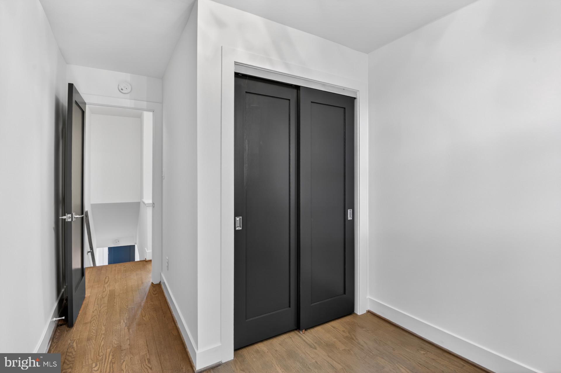 4416 Reno Road Northwest Washington, DC 20008 - Photo 21 of 39 a view of hallway with wooden floor