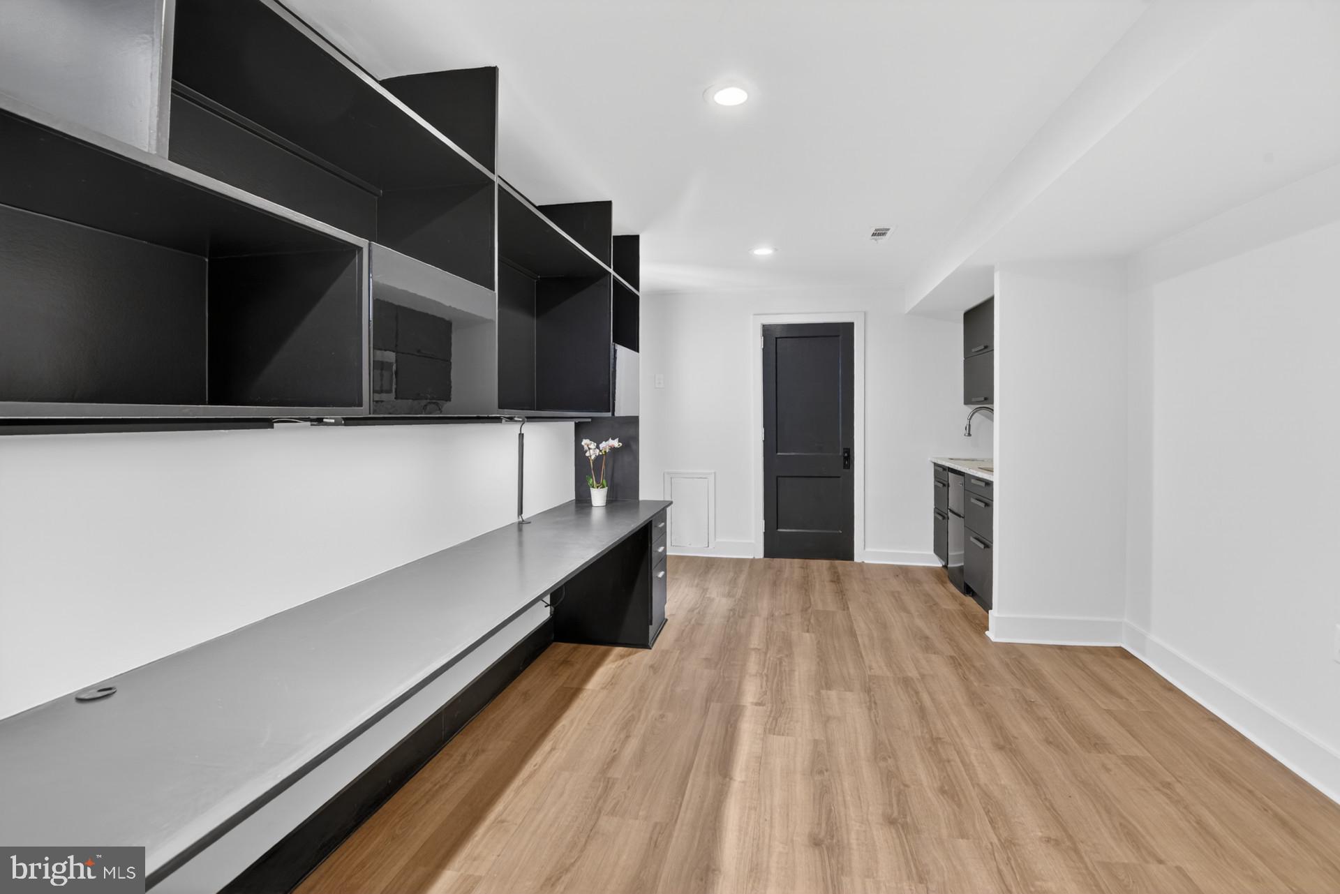 4416 Reno Road Northwest Washington, DC 20008 - Photo 25 of 39 a view of hallway with stairs and wooden floor