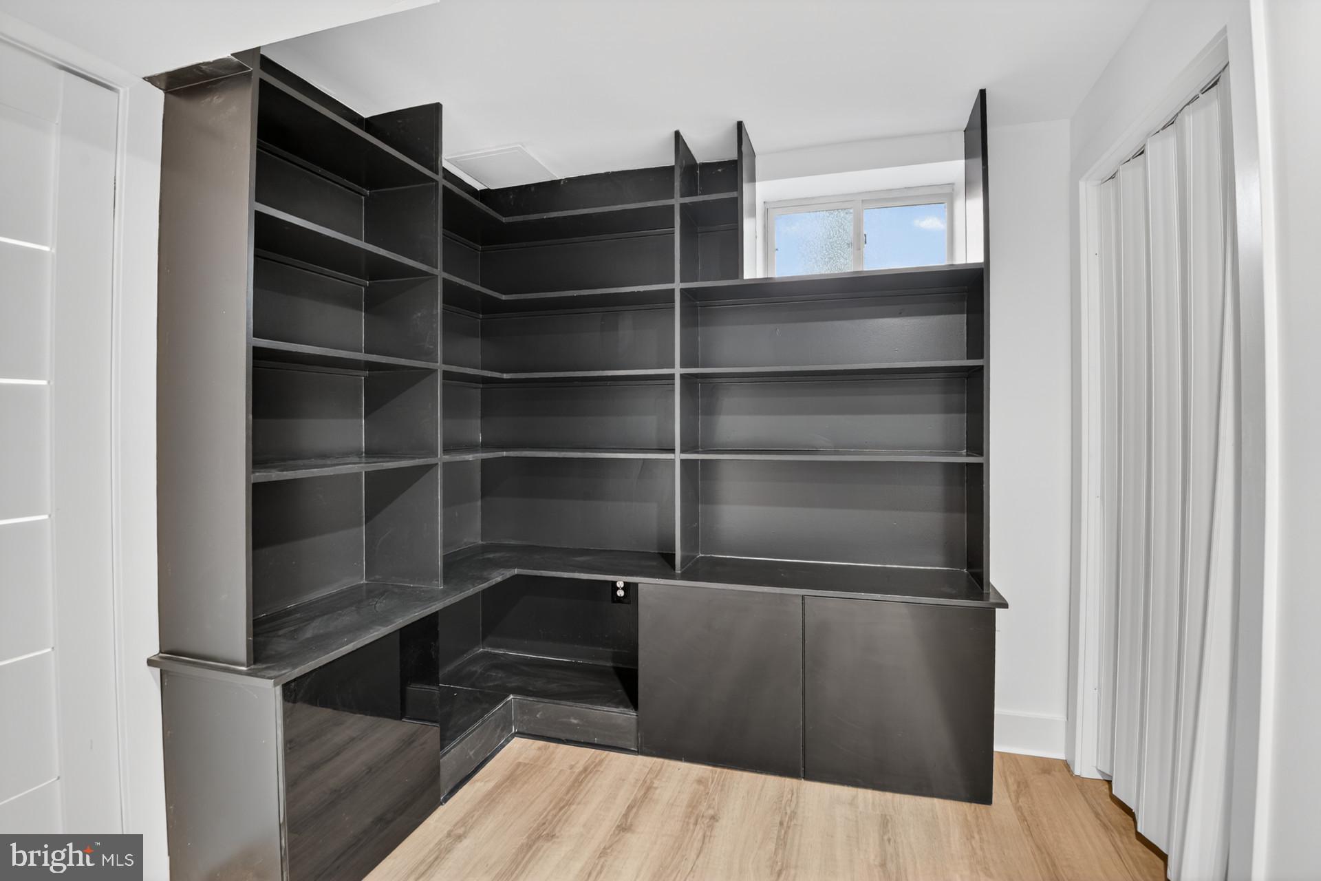 4416 Reno Road Northwest Washington, DC 20008 - Photo 27 of 39 a view of walk in closet with empty racks