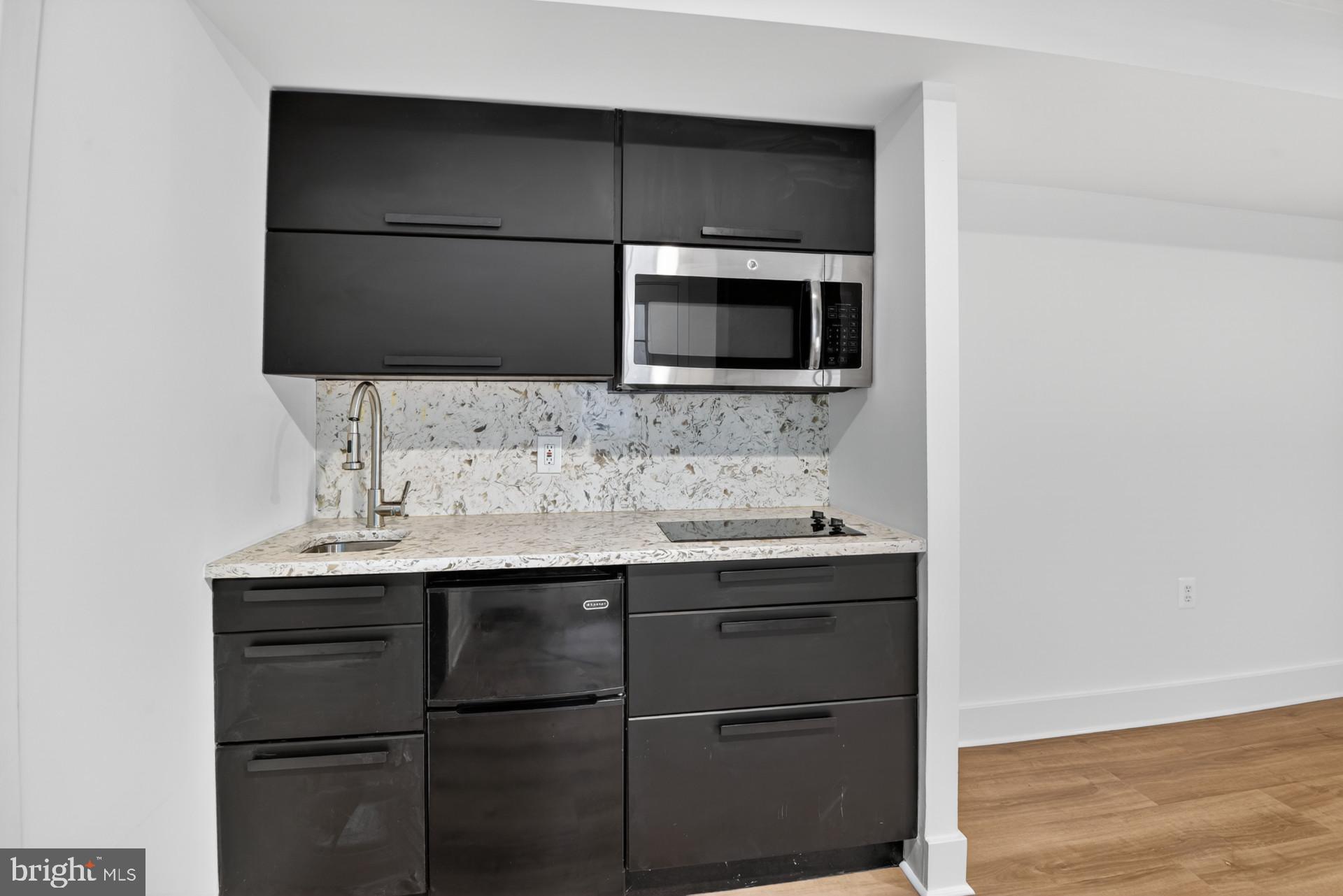4416 Reno Road Northwest Washington, DC 20008 - Photo 28 of 39 a bathroom with a sink and a microwave
