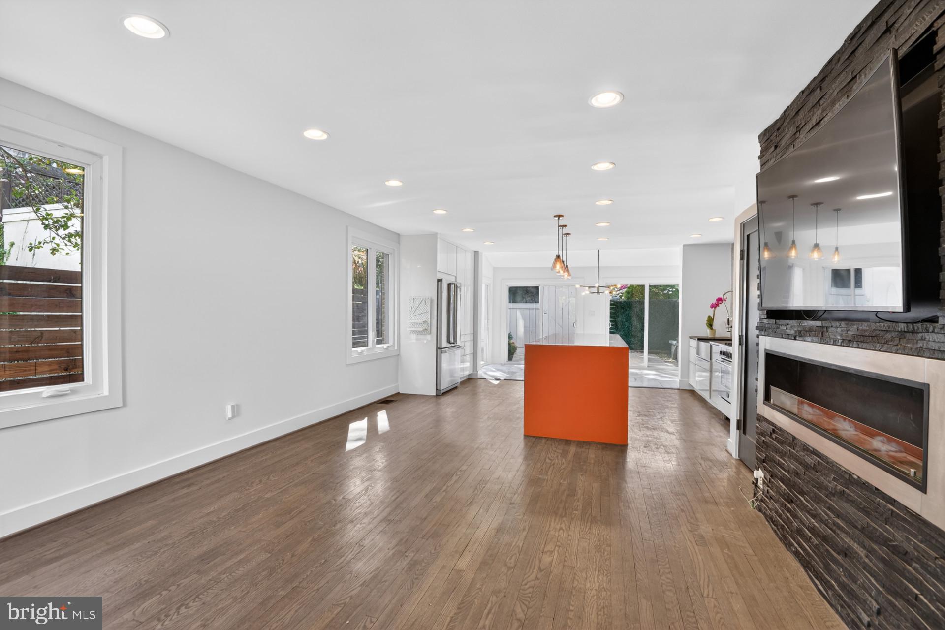 4416 Reno Road Northwest Washington, DC 20008 - Photo 10 of 39 a view of kitchen with stainless steel appliances granite countertop a stove a sink a refrigerator and a wooden floor