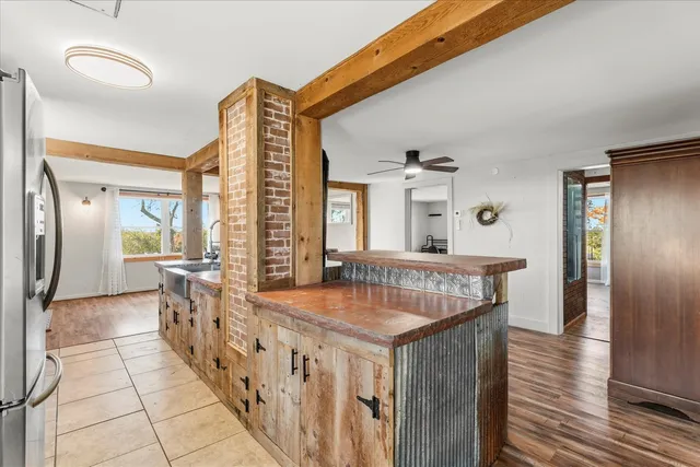 a view of a livingroom with furniture and hardwood floor