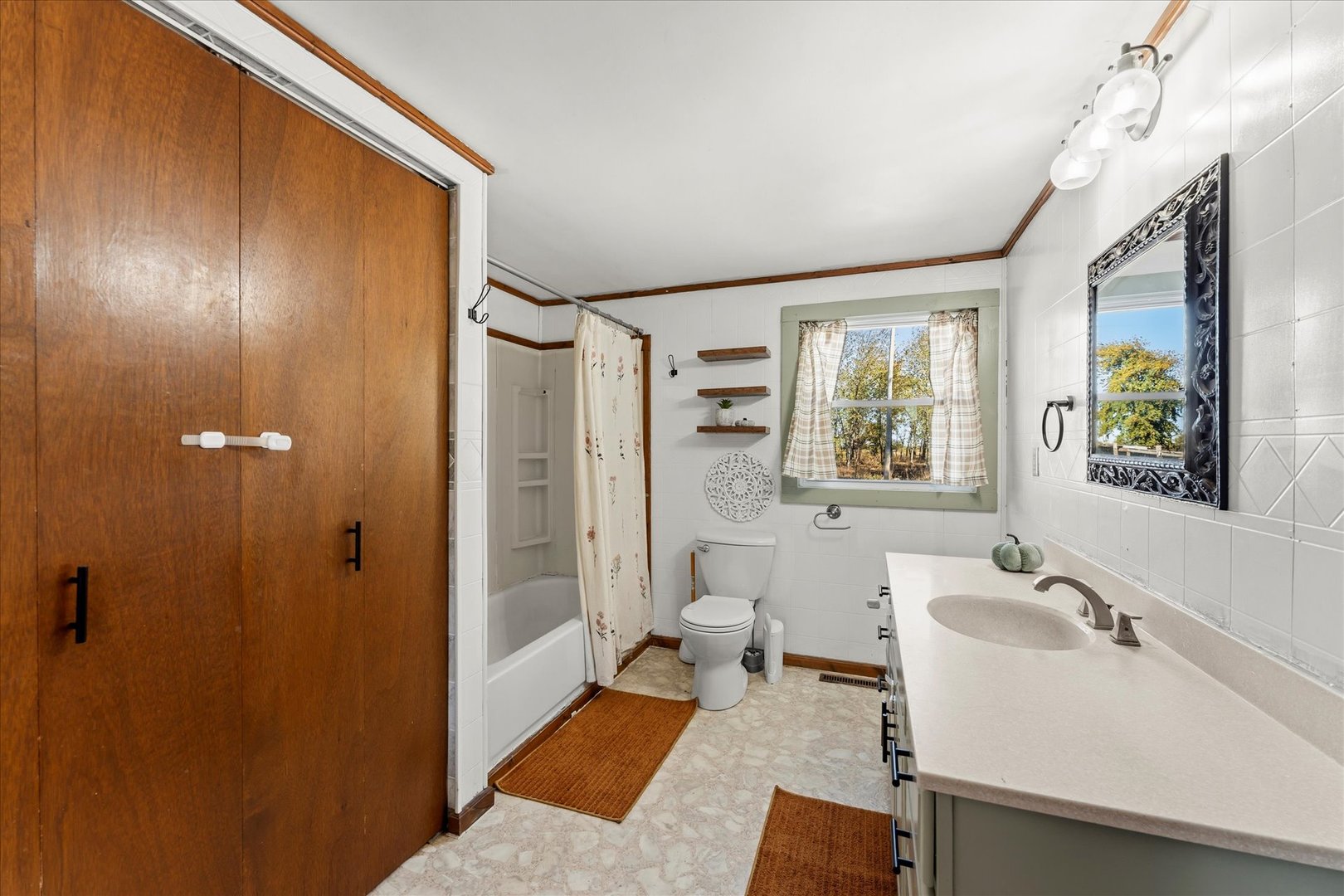 1311 East 4140 North Road Rankin, IL 60960 - Photo 29 of 54 a bathroom with a sink and a mirror