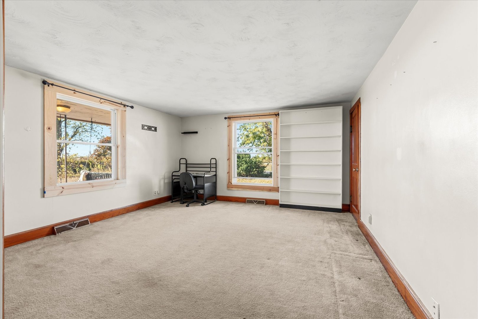 1311 East 4140 North Road Rankin, IL 60960 - Photo 32 of 54 an empty room with furniture and a window