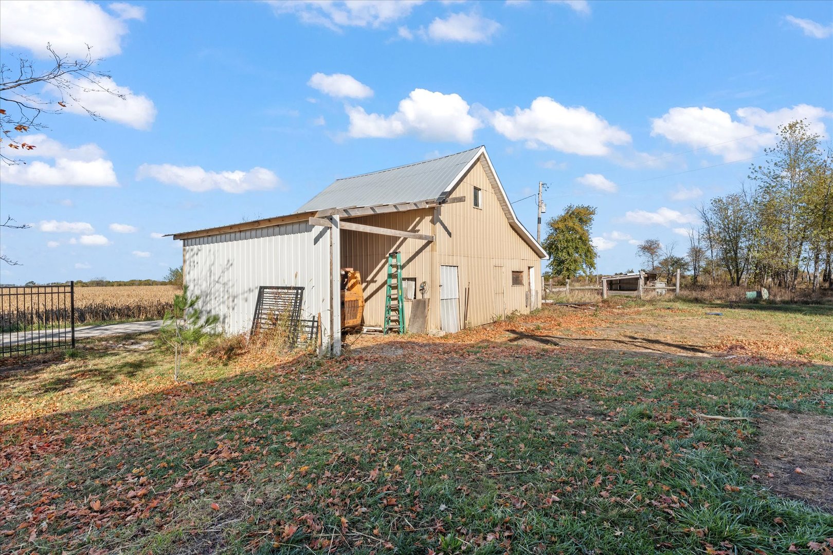 1311 East 4140 North Road Rankin, IL 60960 - Photo 42 of 54 a view of a house with a yard