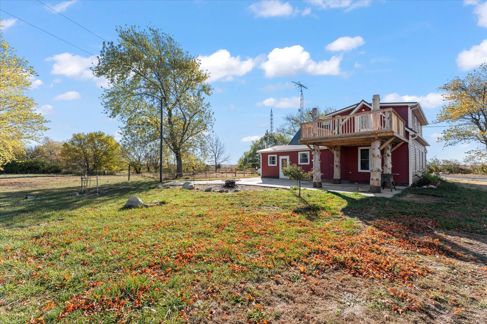 1311 East 4140 North Road Rankin, IL 60960 - Photo 45 of 54 a front view of a house with a garden and swimming pool
