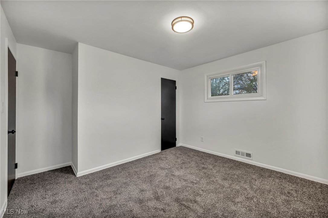 2666 Dentzler Road Parma, OH 44134 - Photo 14 of 41 Carpeted spare room featuring baseboards and visible vents