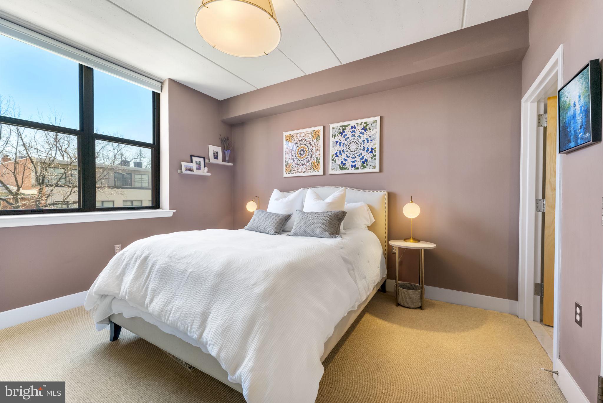 1529 14th Street Northwest, Unit 309 Washington, DC 20005 - Photo 10 of 21 a bedroom with a bed and window