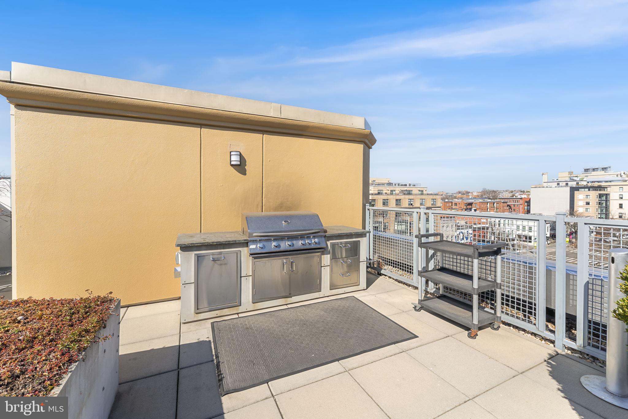 1529 14th Street Northwest, Unit 309 Washington, DC 20005 - Photo 18 of 21 a terrace with a chair and table