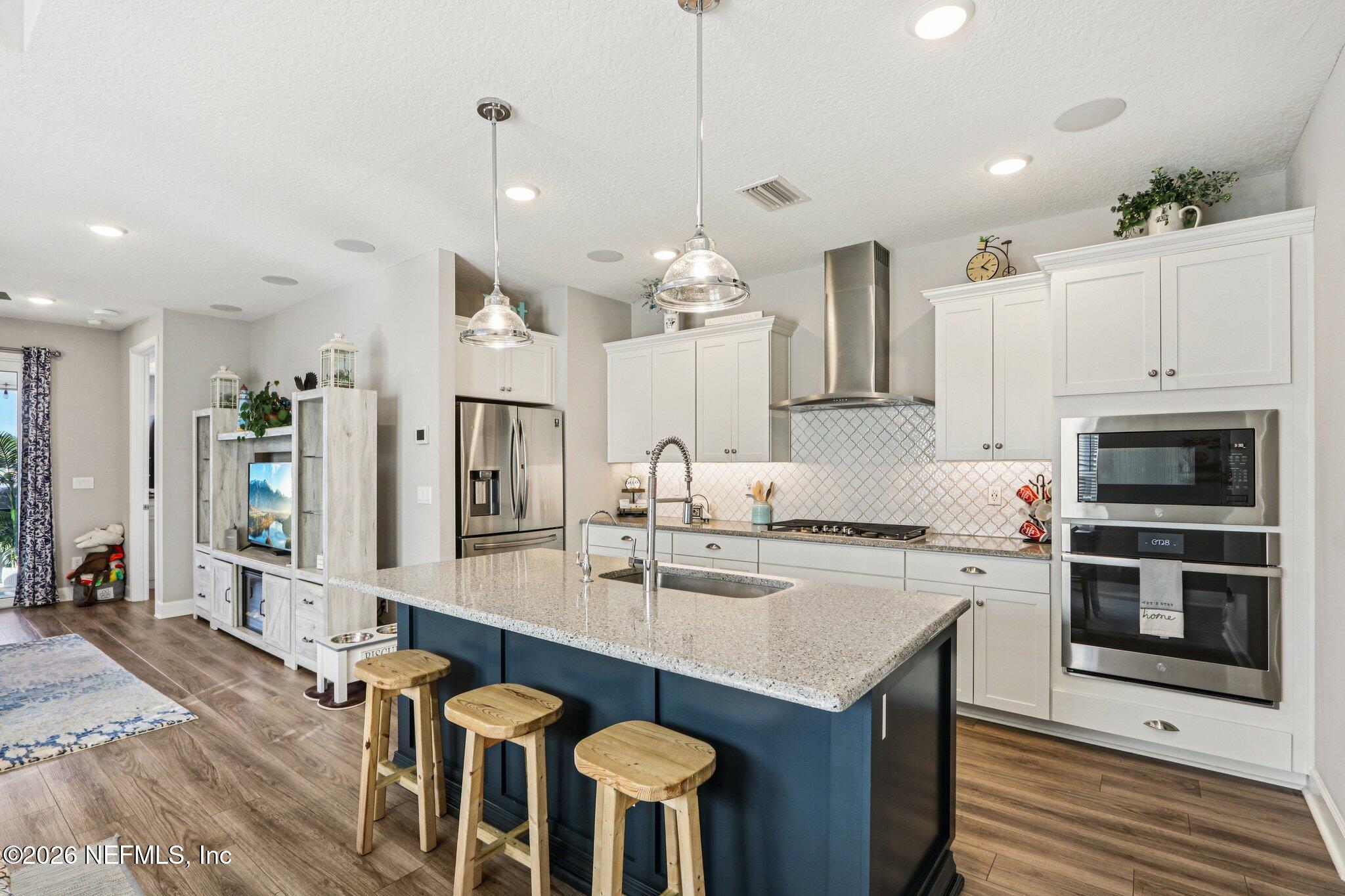 73 Andesite Trail Ponte Vedra, FL 32081 - Photo 11 of 42 a kitchen with granite countertop a sink stove and refrigerator