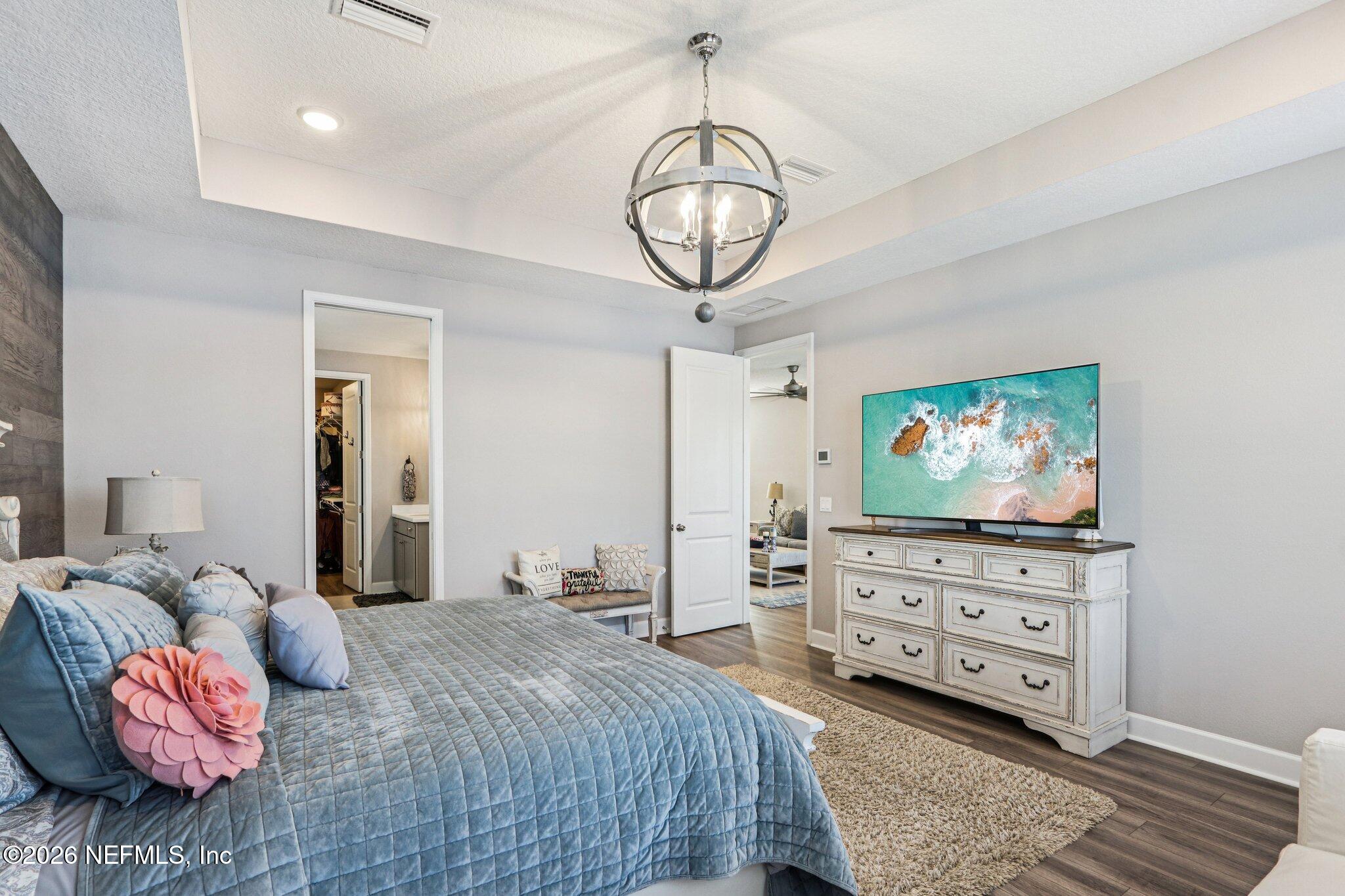 73 Andesite Trail Ponte Vedra, FL 32081 - Photo 17 of 42 a bedroom with furniture and a flat screen tv