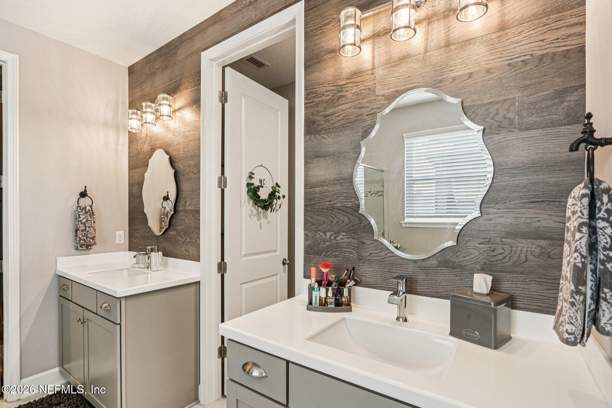 73 Andesite Trail Ponte Vedra, FL 32081 - Photo 18 of 42 a bathroom with a sink mirror and vanity