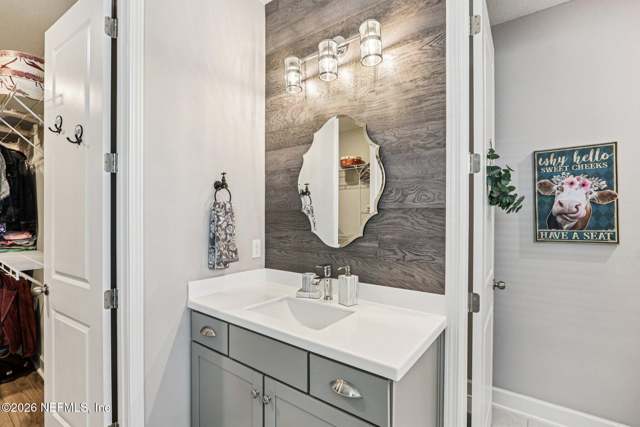 73 Andesite Trail Ponte Vedra, FL 32081 - Photo 21 of 42 a bathroom with a sink and a mirror