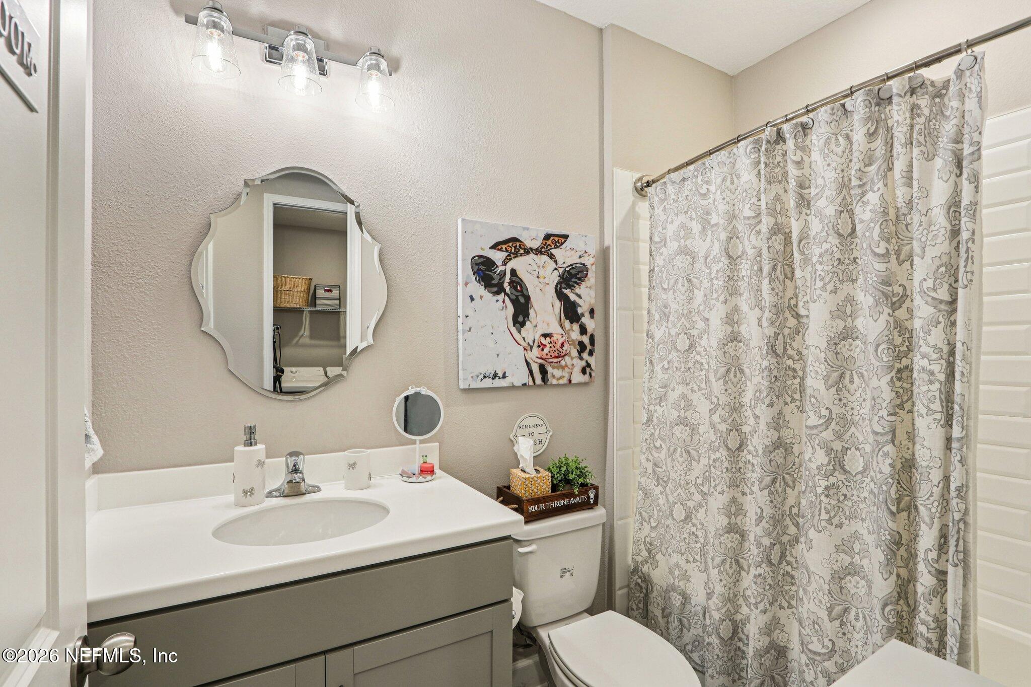 73 Andesite Trail Ponte Vedra, FL 32081 - Photo 23 of 42 a bathroom with a toilet sink and mirror