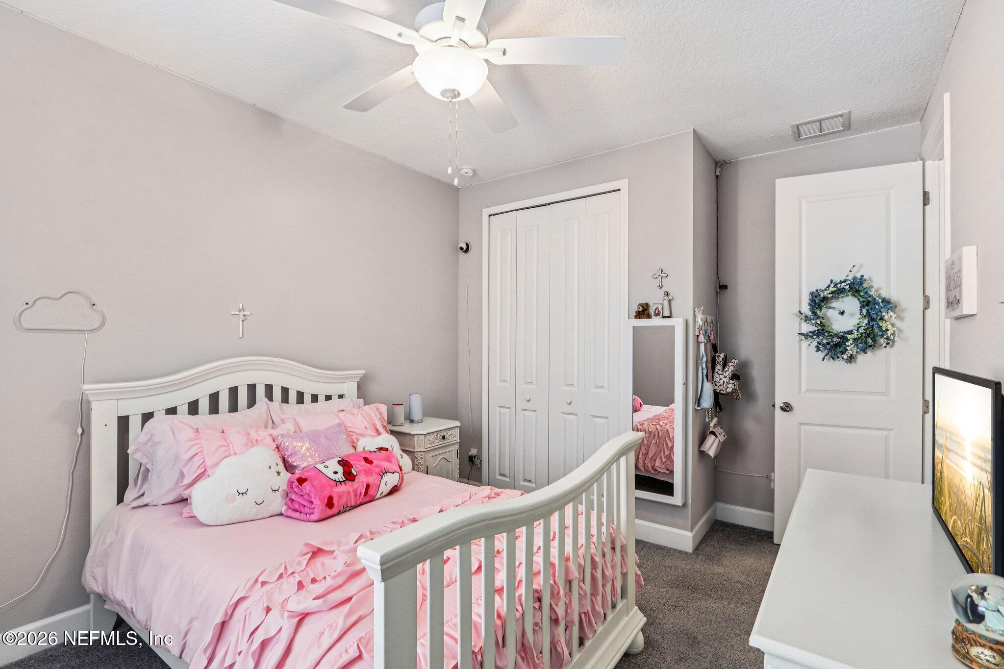 73 Andesite Trail Ponte Vedra, FL 32081 - Photo 25 of 42 a bedroom with a bed and a window