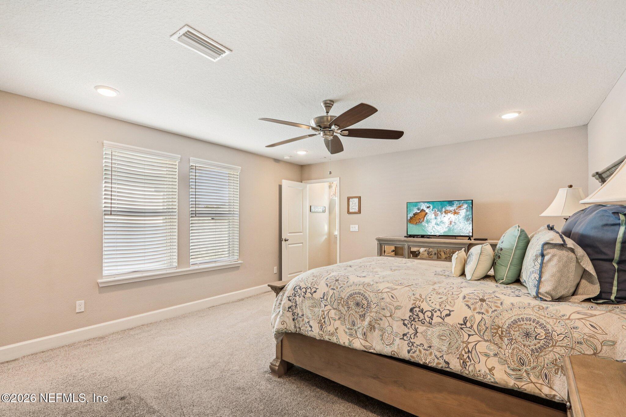 73 Andesite Trail Ponte Vedra, FL 32081 - Photo 29 of 42 a bedroom with a bed and a large window