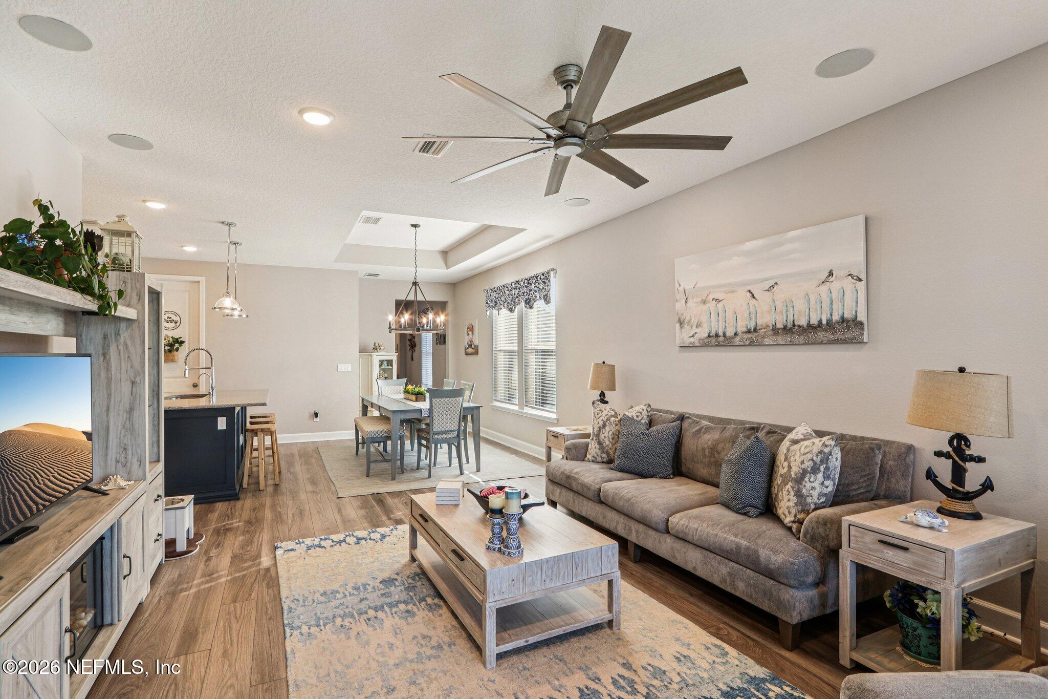 73 Andesite Trail Ponte Vedra, FL 32081 - Photo 6 of 42 a living room with furniture and a flat screen tv