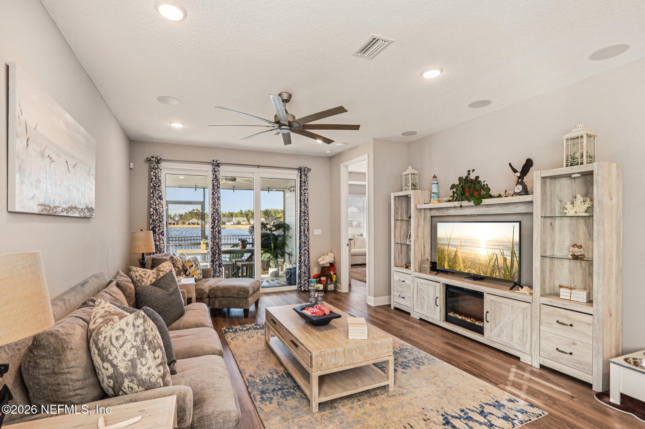 73 Andesite Trail Ponte Vedra, FL 32081 - Photo 8 of 42 a living room with furniture and a flat screen tv