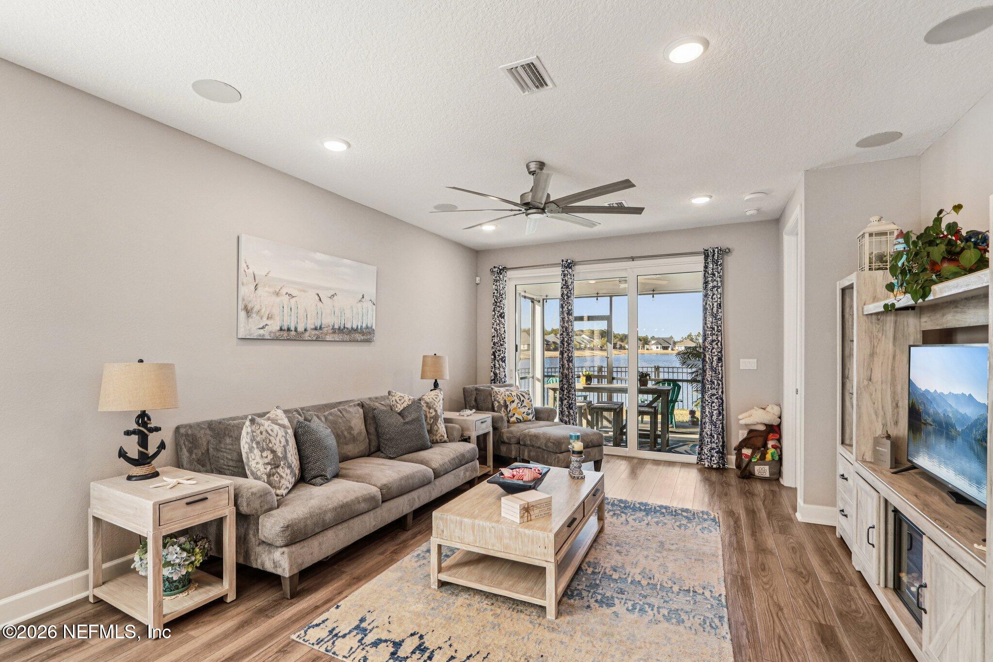 73 Andesite Trail Ponte Vedra, FL 32081 - Photo 9 of 42 a living room with furniture and a flat screen tv