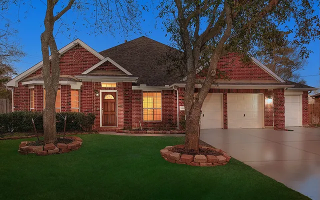 a front view of a house with a yard fire pit and outdoor seating