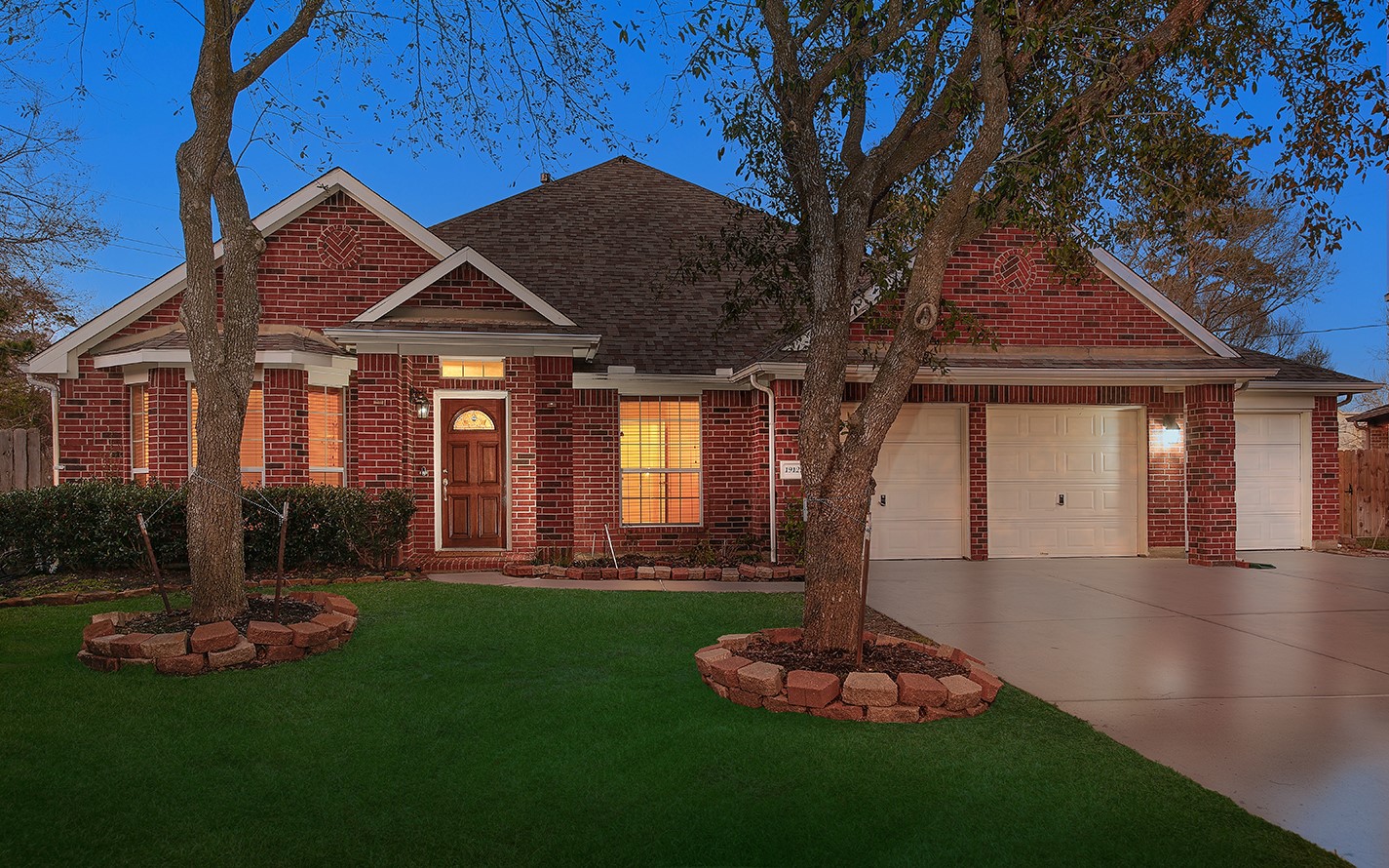 a front view of a house with a yard fire pit and outdoor seating