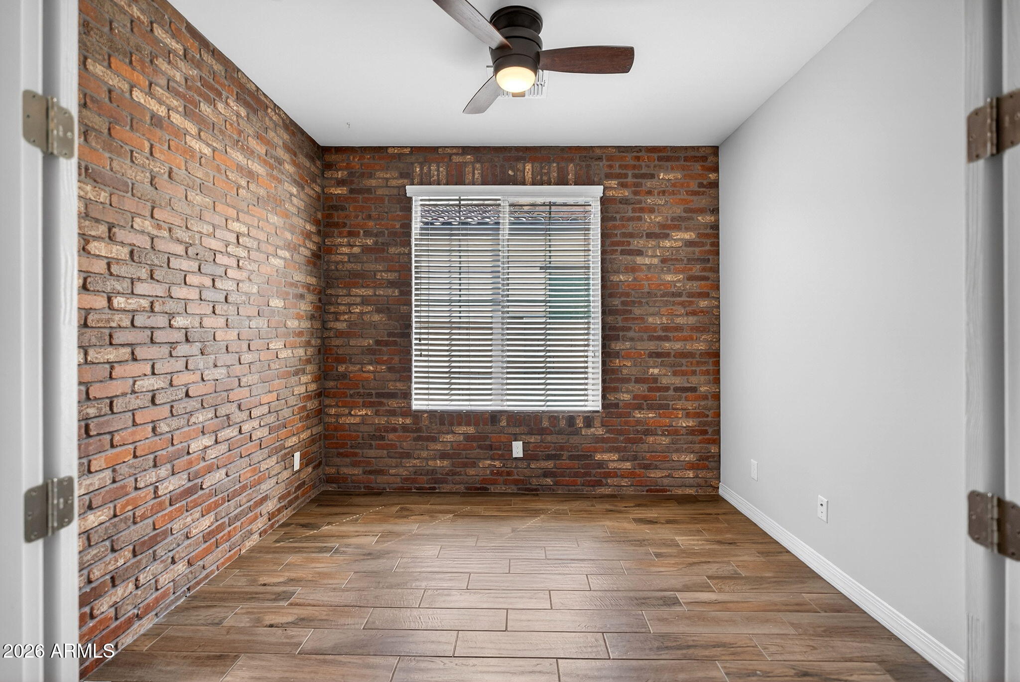 12124 West Peak View Road Peoria, AZ 85383 - Photo 12 of 38 a view of door with wooden floor