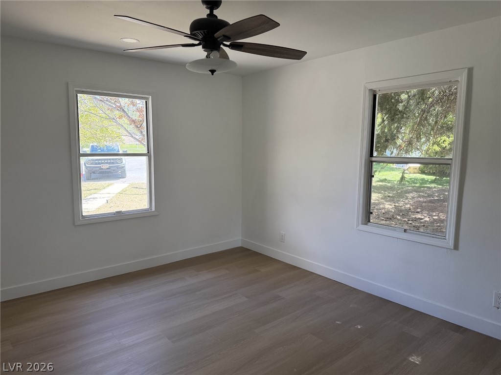 1 Carson Court Ely, NV 89301 - Photo 9 of 20 This naturally illuminated bedroom offers wood flooring and a modern ceiling fan for optimal comfort.