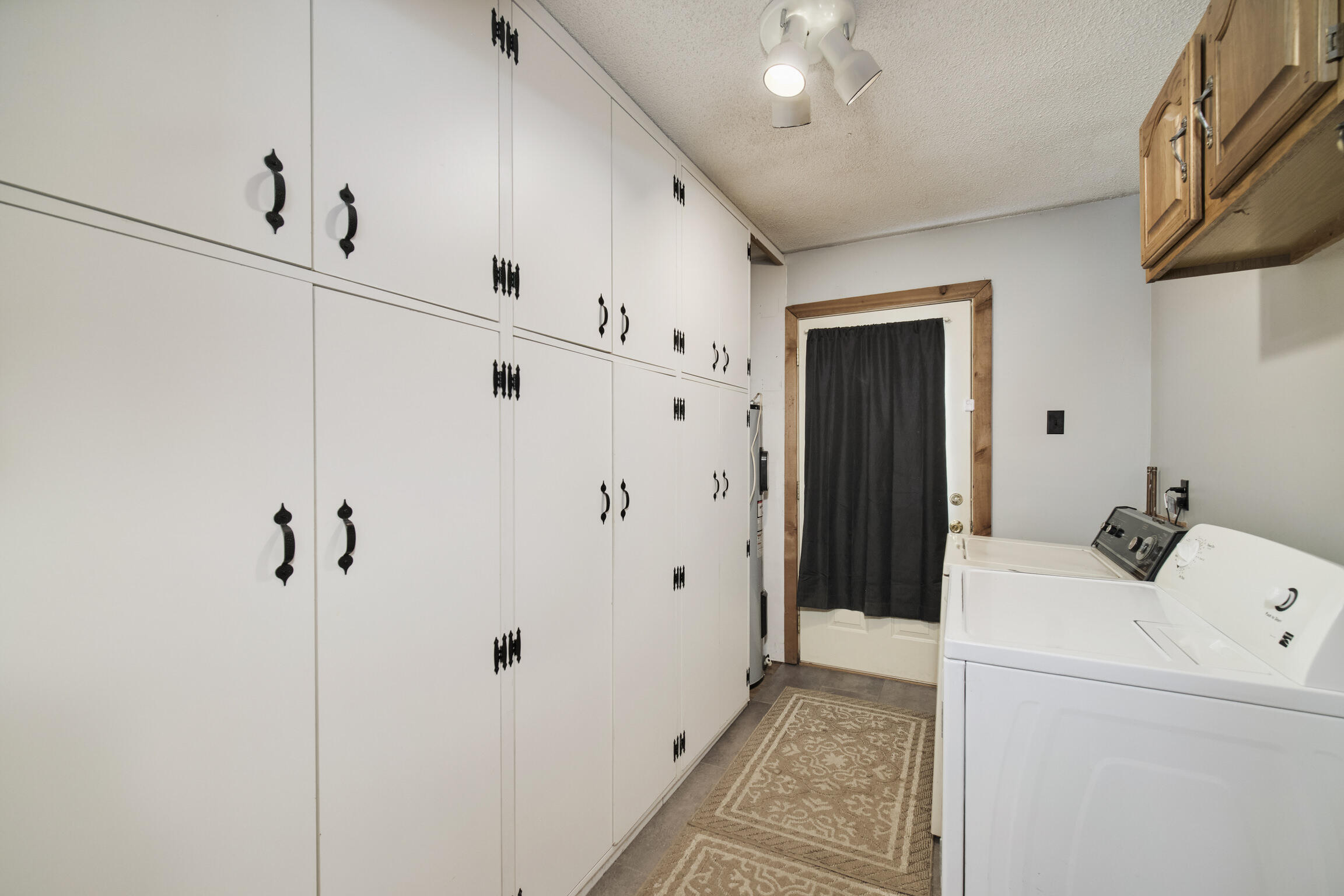 925 South High Bridge Road Wellston, MI 49689 - Photo 28 of 55 Built-in storage in laundry room